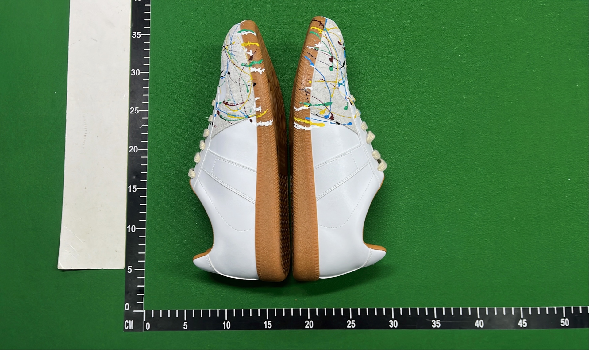 Adidas White Sneakers with Colorful Paint Splatter Design