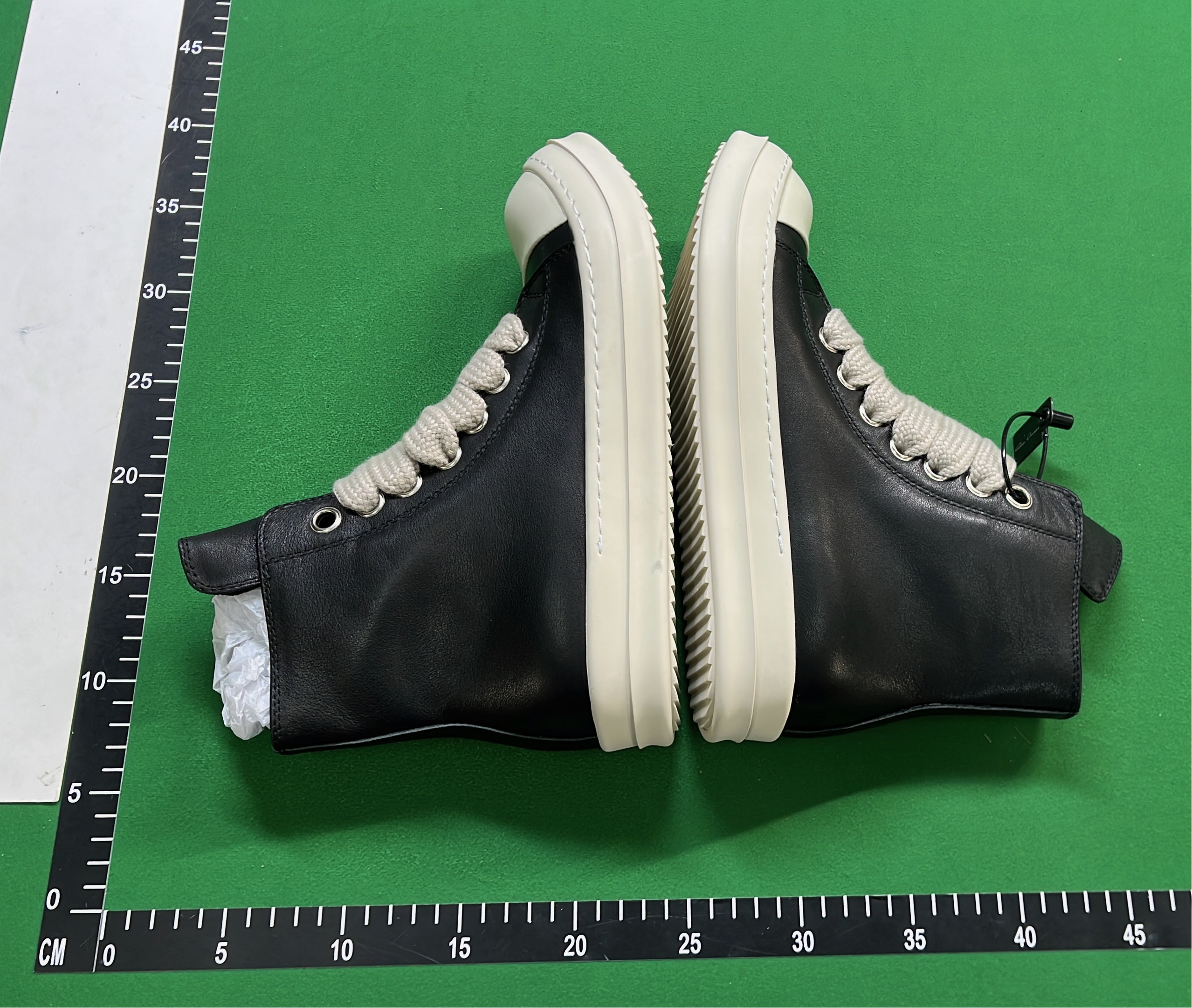 Black High-Top Sneakers with White Laces and Sole