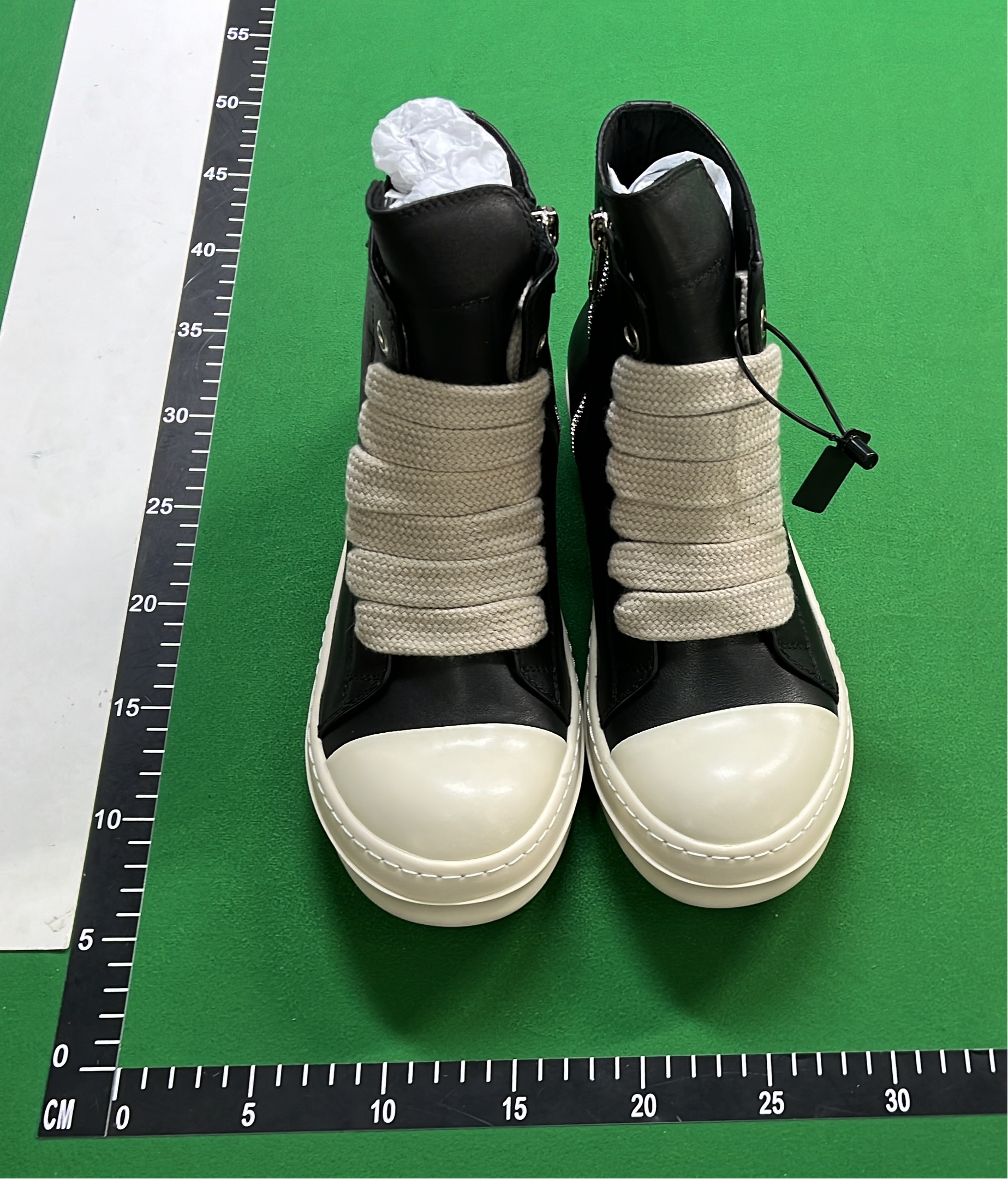 Black High-Top Sneakers with White Laces and Sole