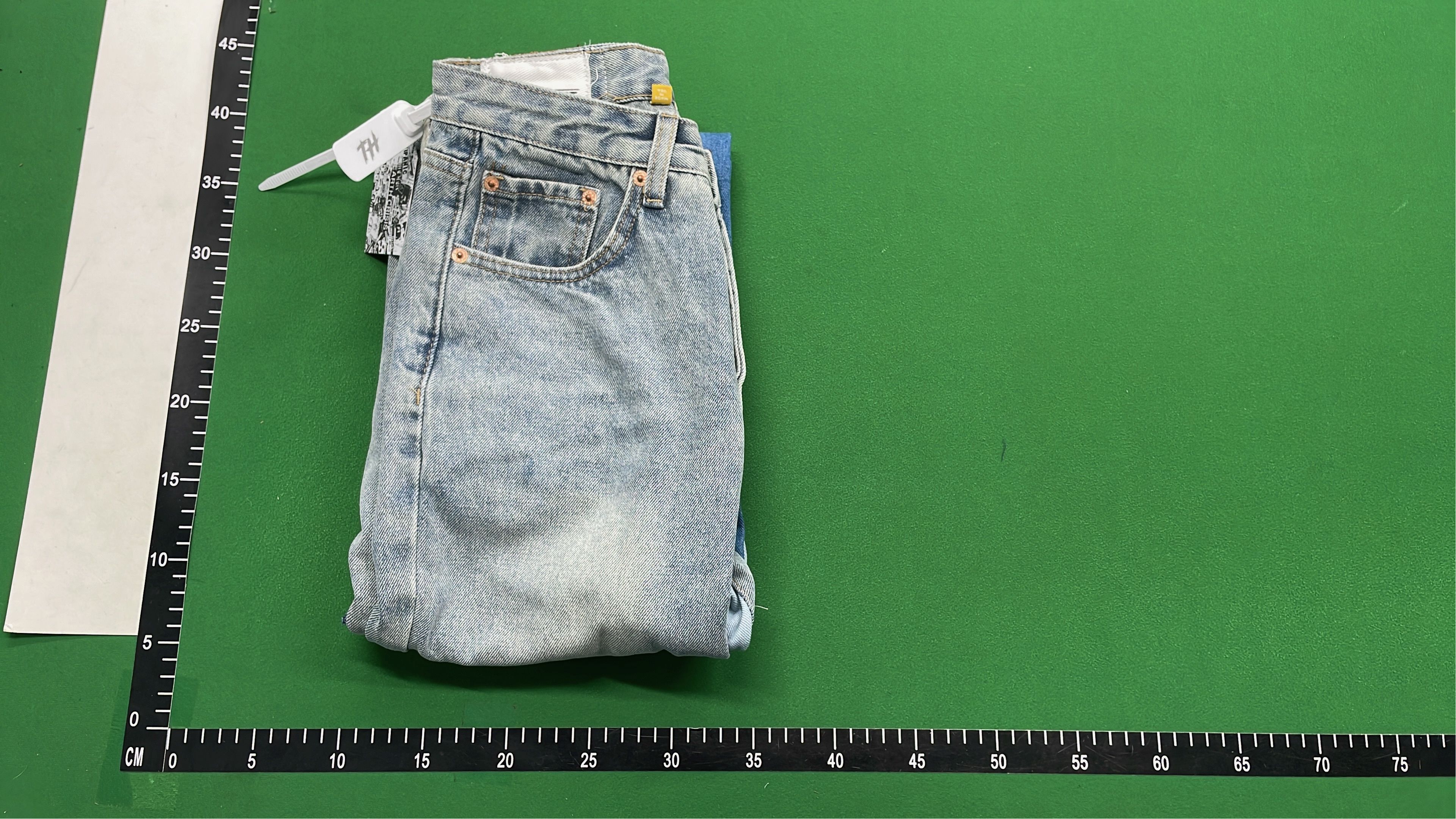 Vintage Patchwork Denim Jeans with Frayed Hem and Cream Accents