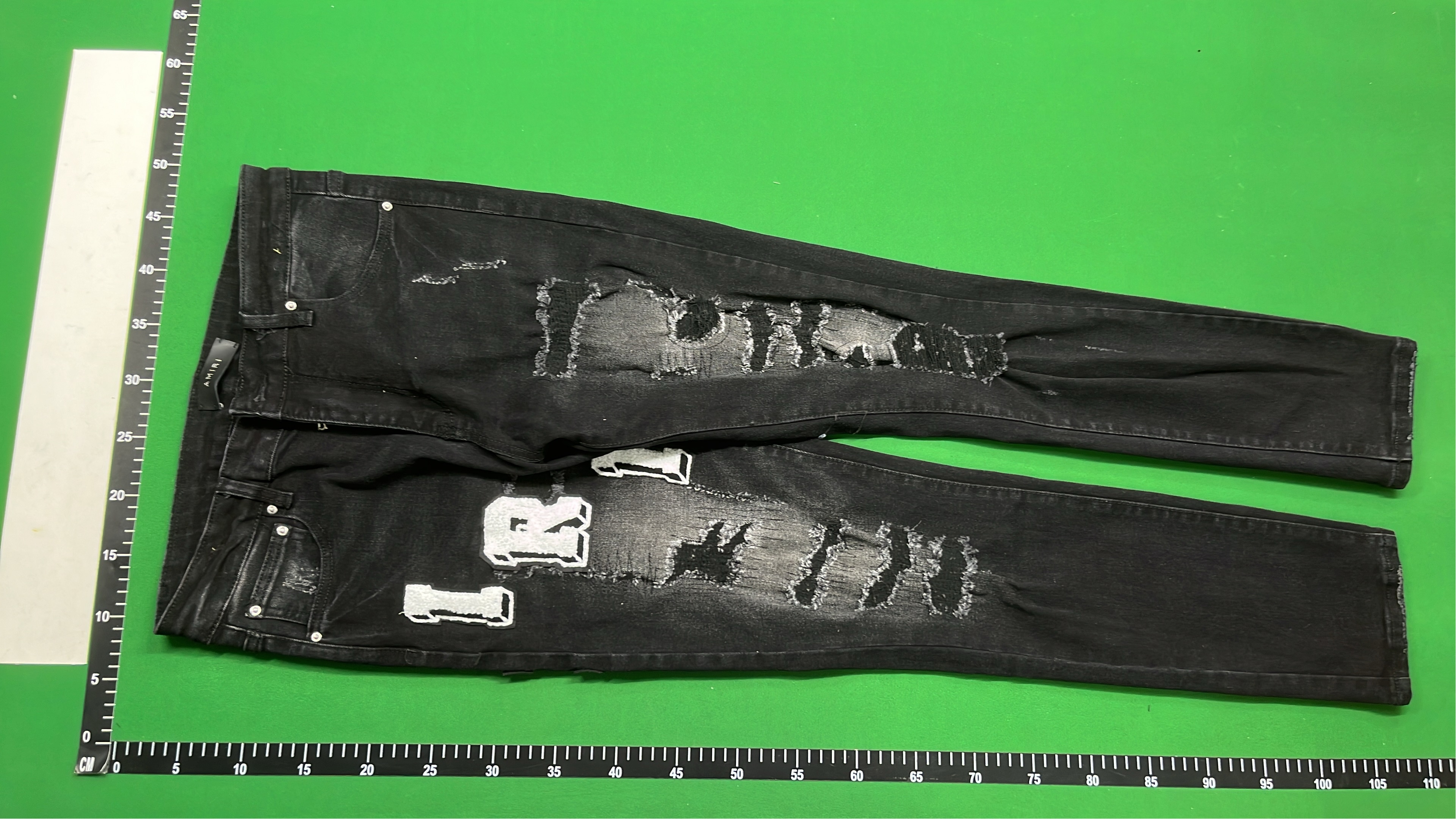 AMIRI Black Distressed Denim Jeans with Angel Print