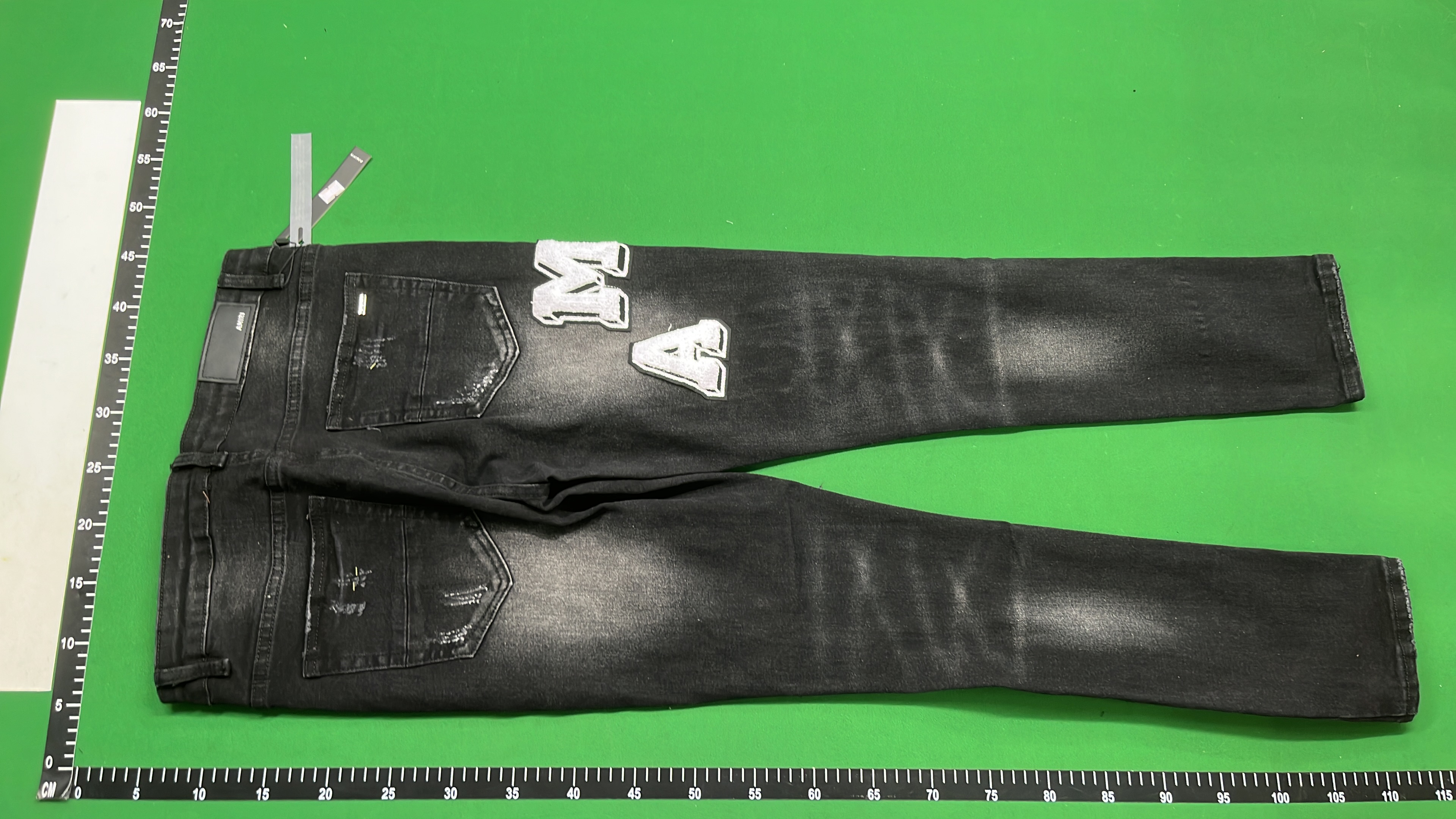 AMIRI Black Distressed Denim Jeans with Angel Print