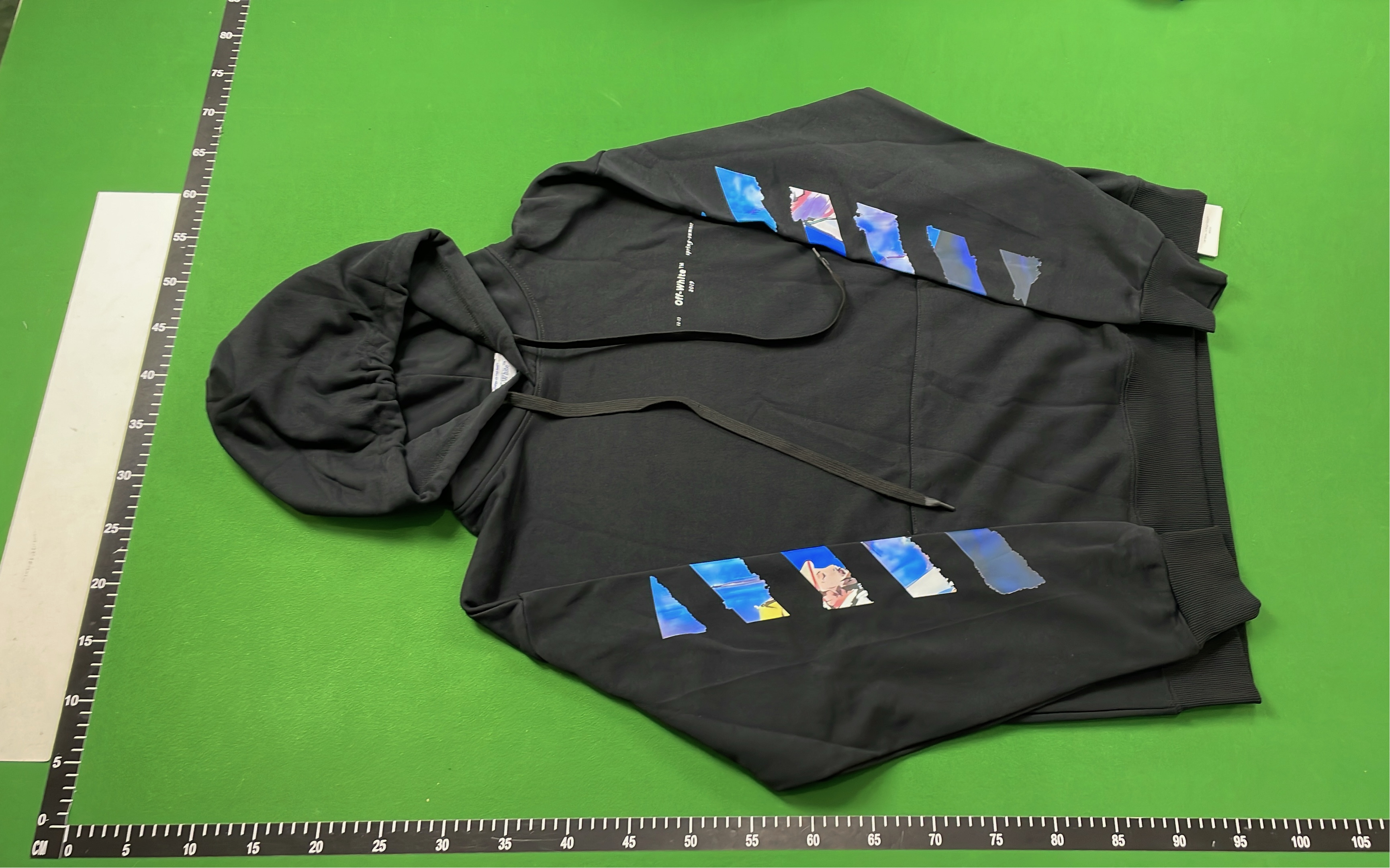 White and Black Patchwork Hoodie with Blue Accents