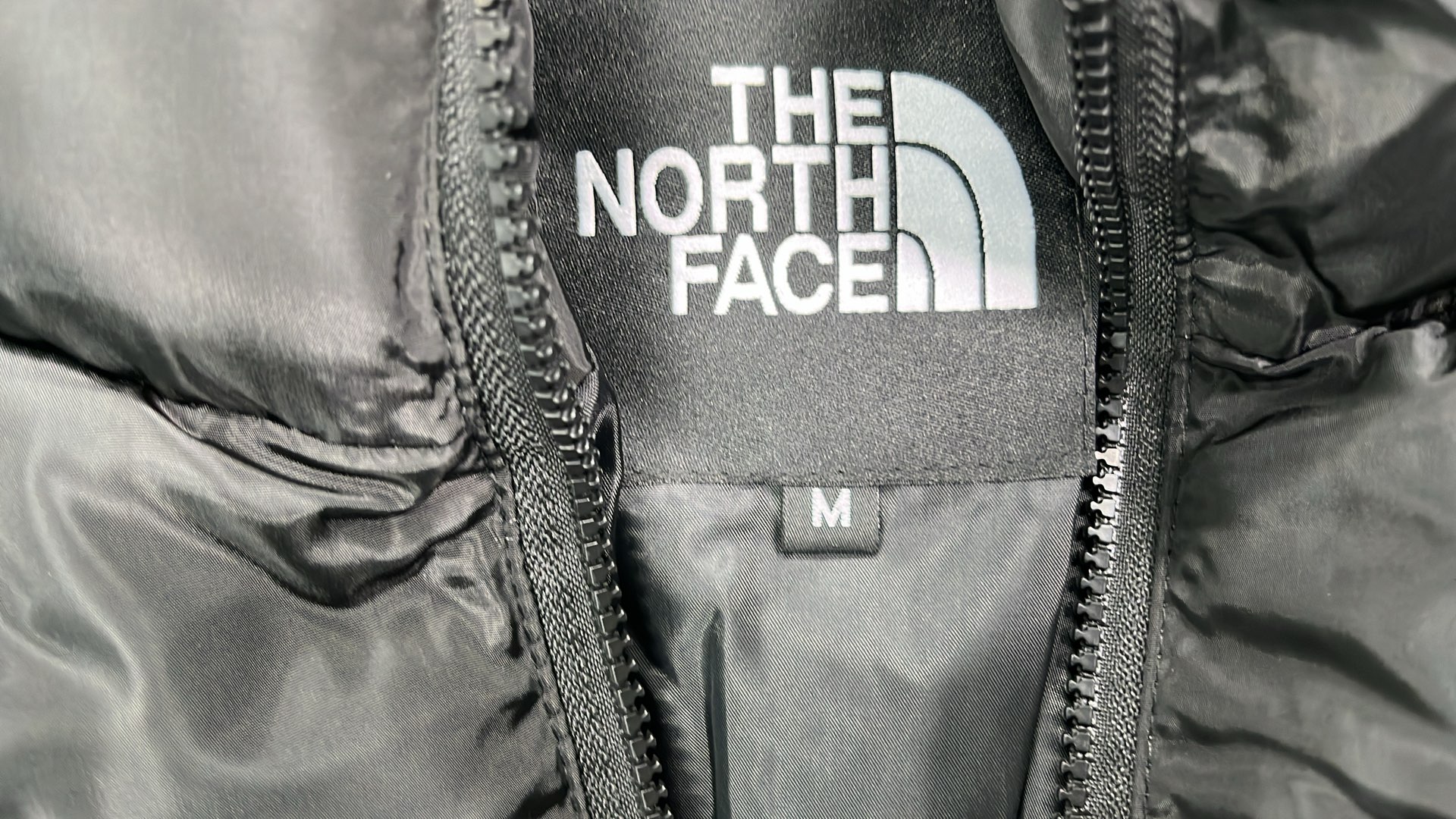 The North Face White Puffer Jacket with Black Collar