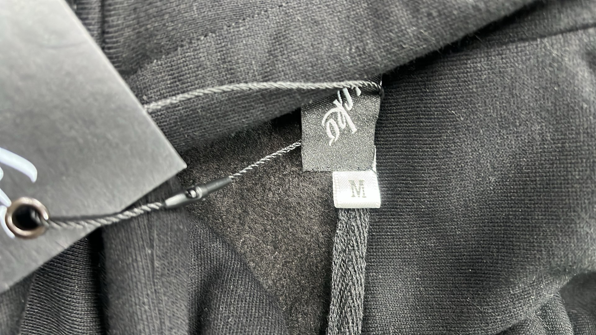 Black Hoodie with Minimalist Design and White Drawstrings