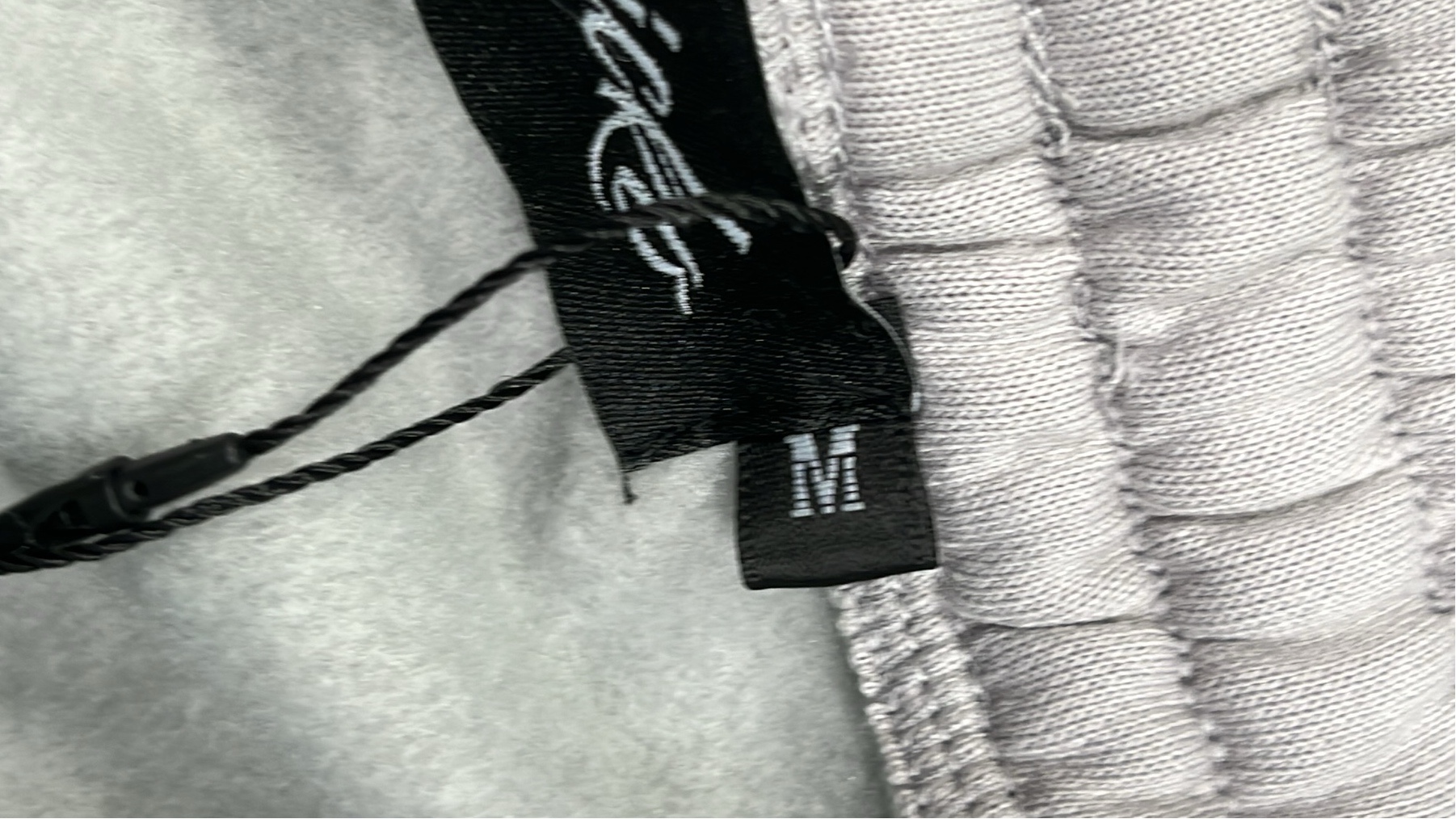 Black Hoodie with Minimalist Design and White Drawstrings