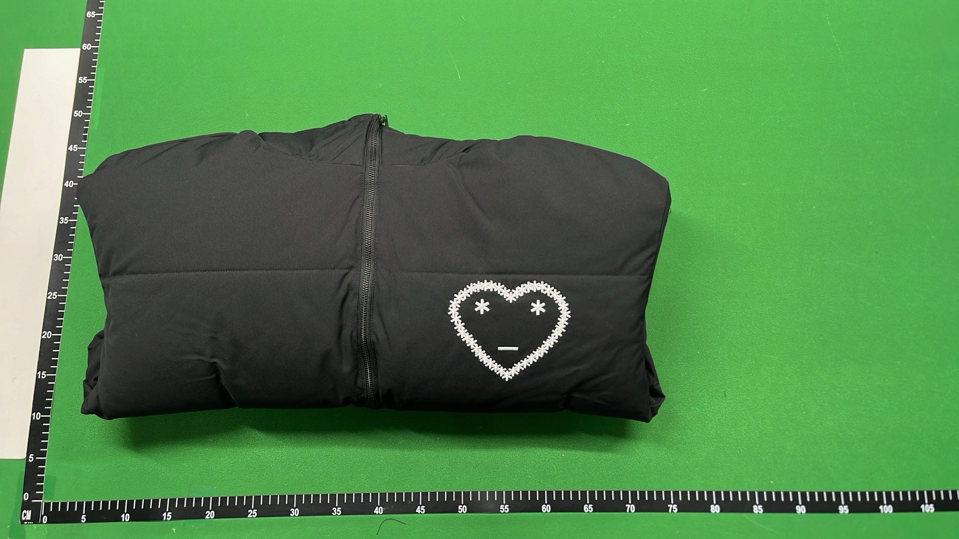 Black Hooded Puffer Jacket with Abstract Design