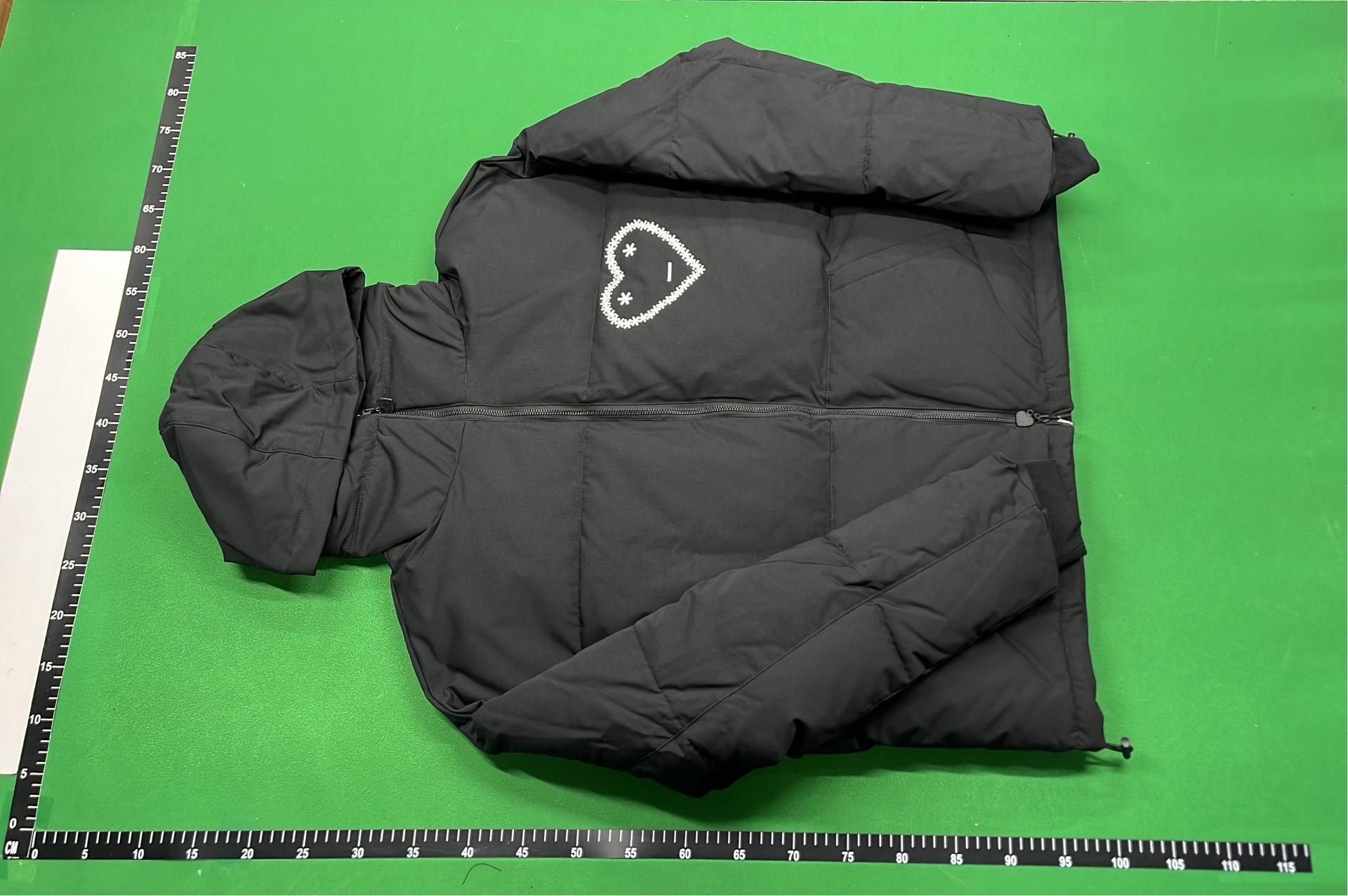 Black Hooded Puffer Jacket with Abstract Design