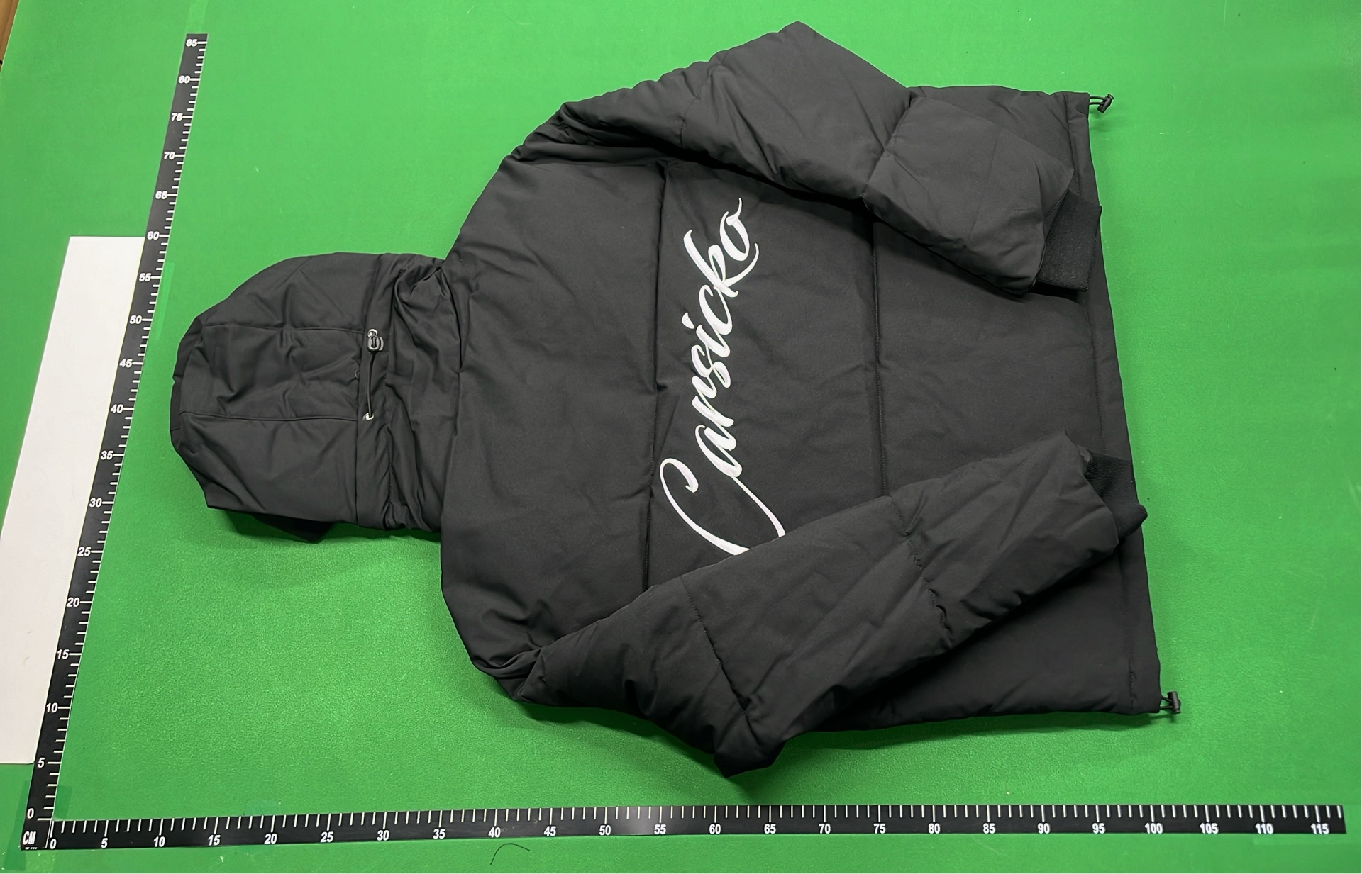 Black Hooded Puffer Jacket with Abstract Design