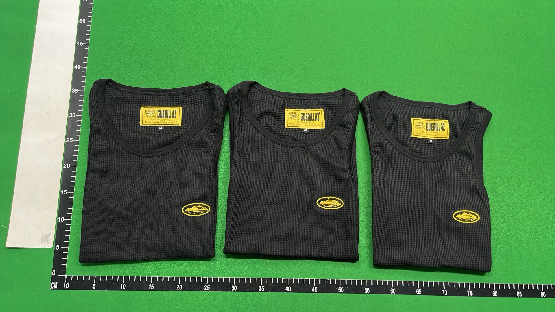 Black Ribbed Tank Top with Yellow Logo