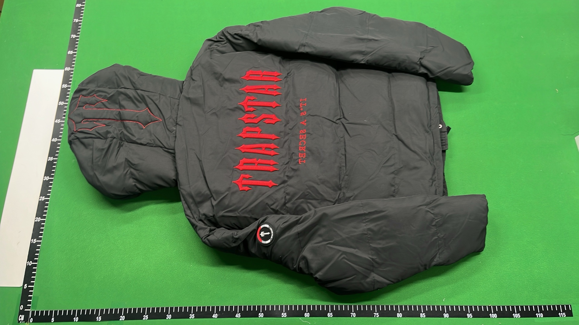 Black Hooded Puffer Jacket with Red Accent Design
