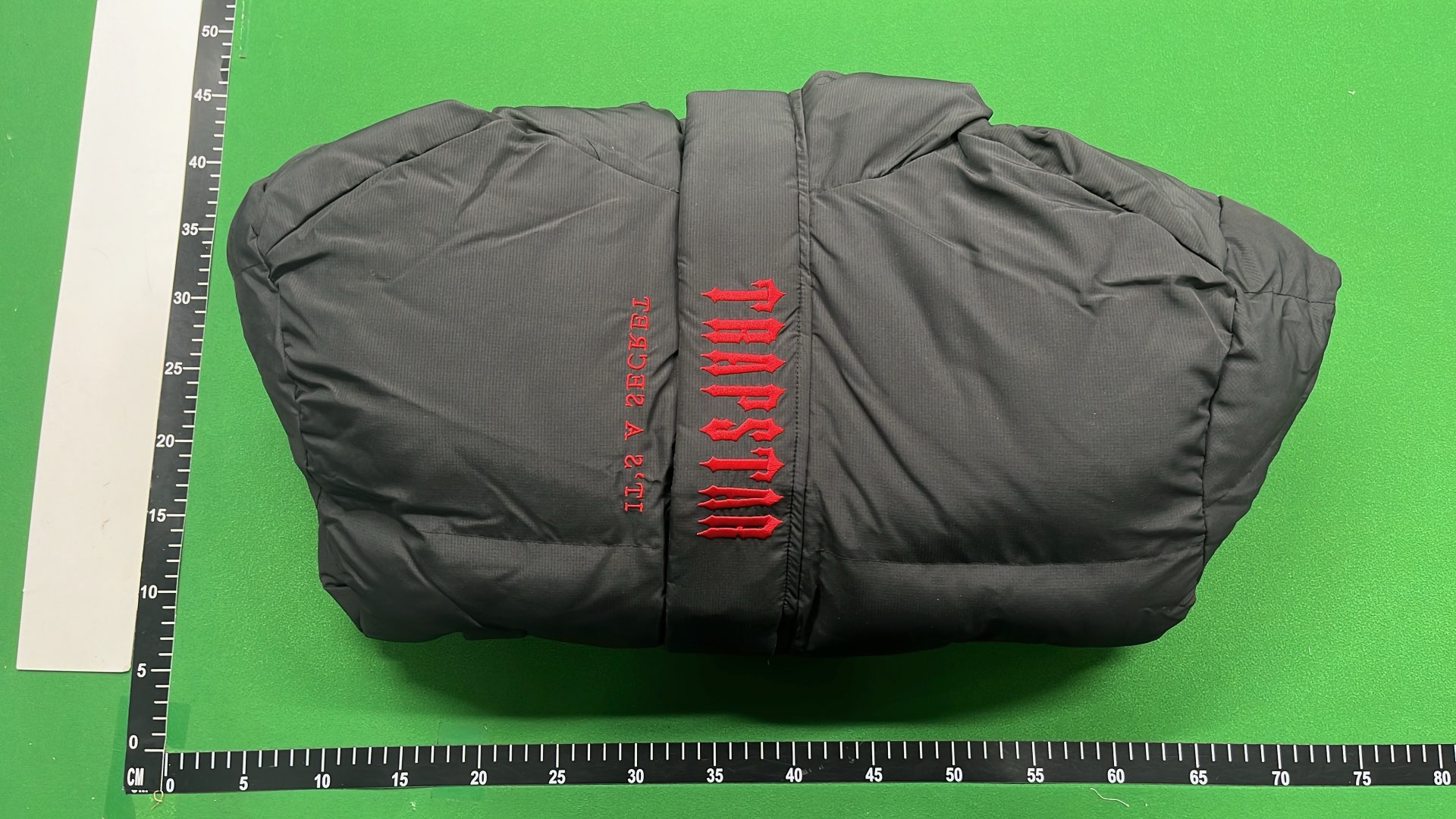 Black Hooded Puffer Jacket with Red Accent Design