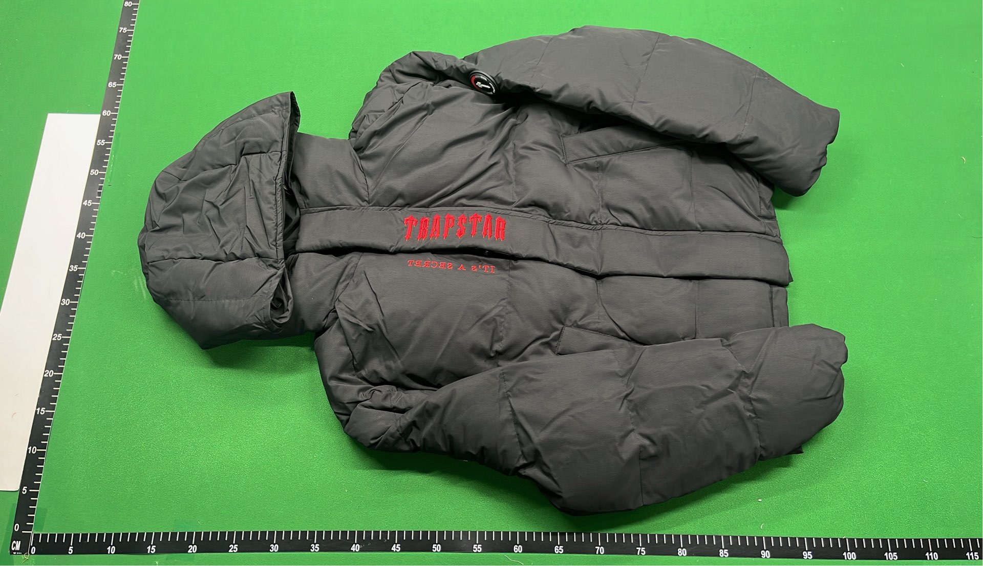 Black Hooded Puffer Jacket with Red Accent Design