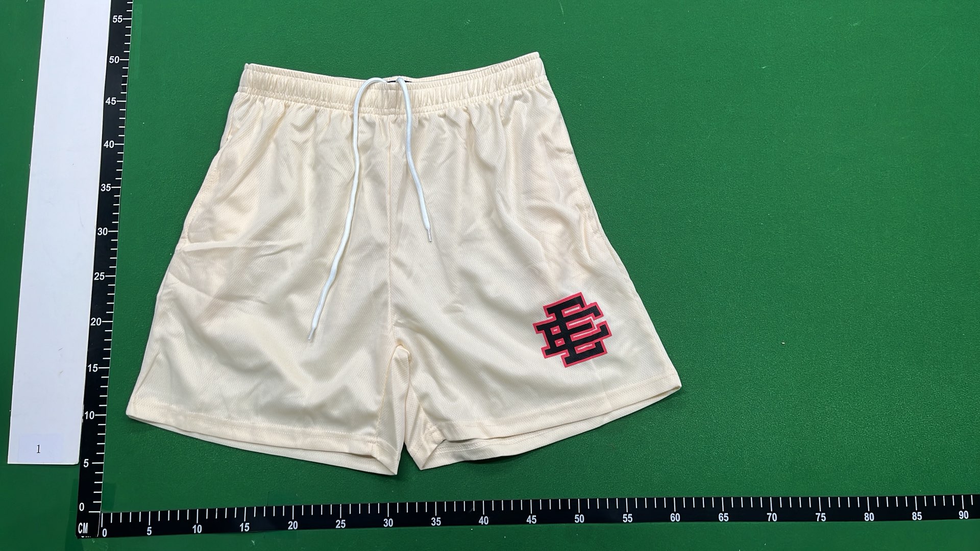 Vibrant Green Mesh Shorts with Logo Design