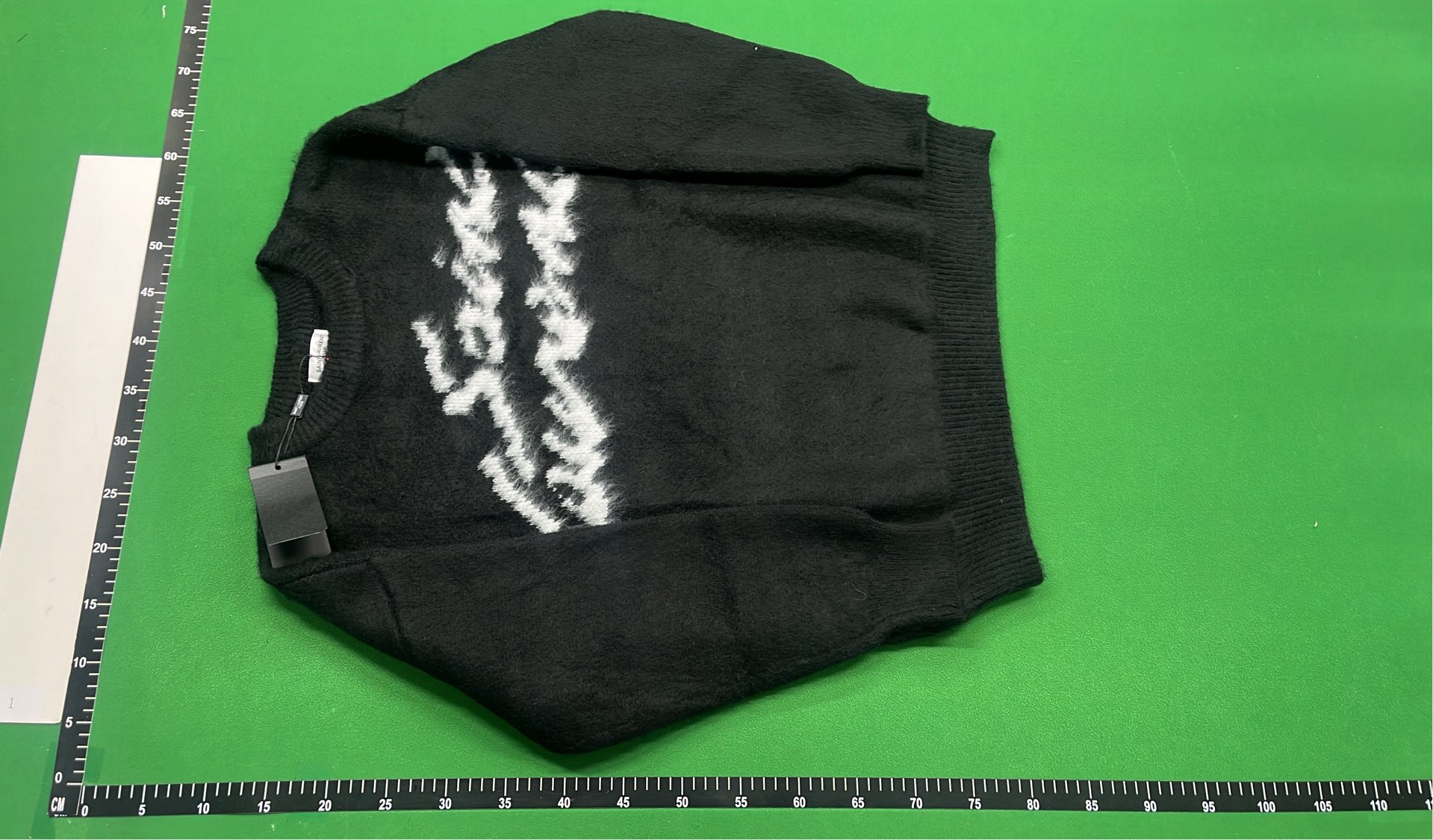 Black Knit Sweater with White Pattern Design