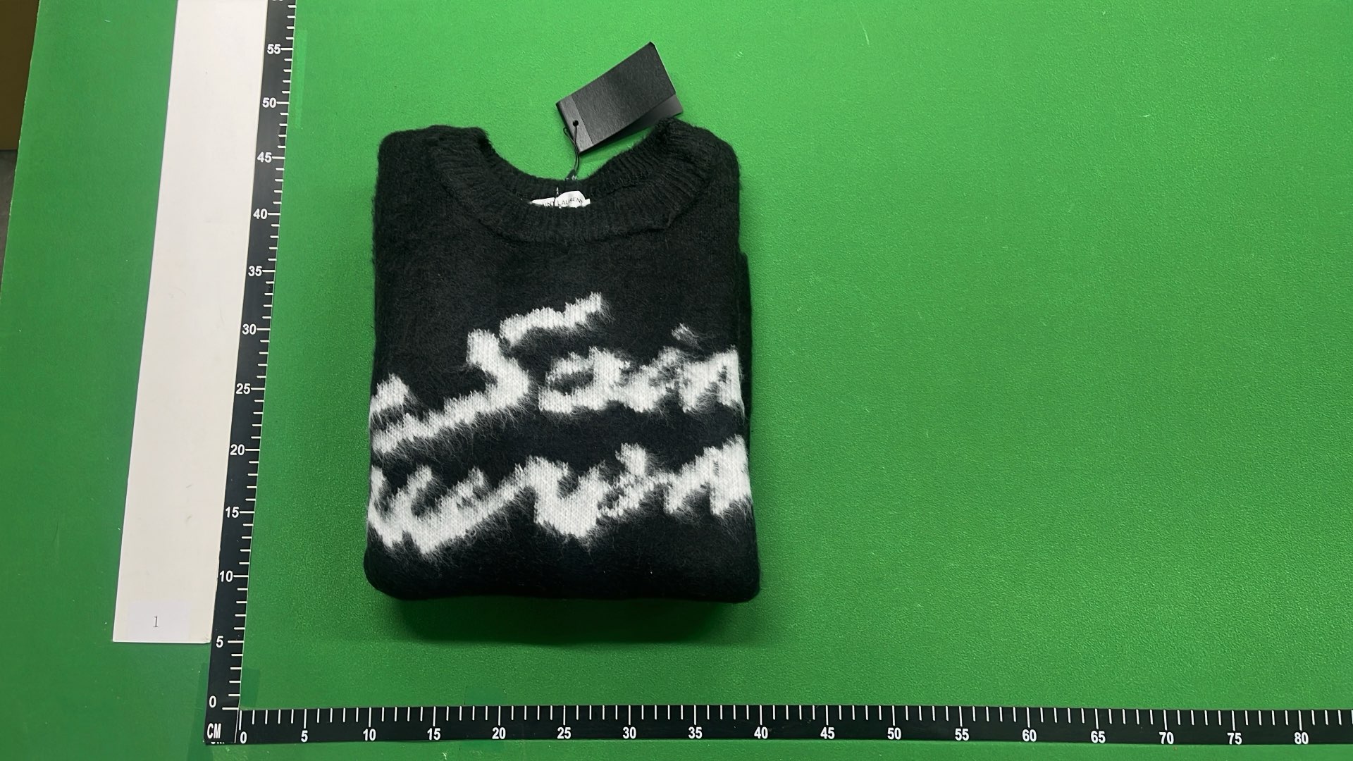 Black Knit Sweater with White Pattern Design