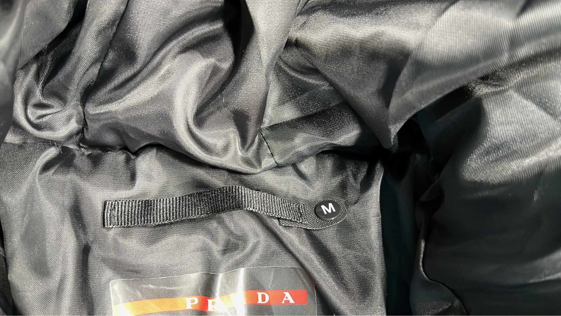 Prada Black Nylon Down Jacket with Hood and Red Logo Strip
