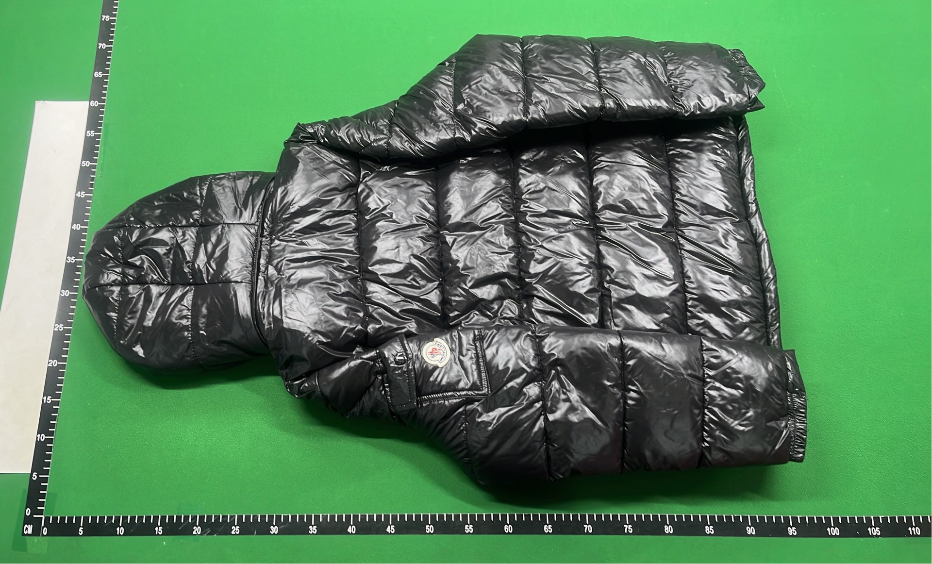 Moncler Black Puffer Jacket with Hood and Red Zip Detail