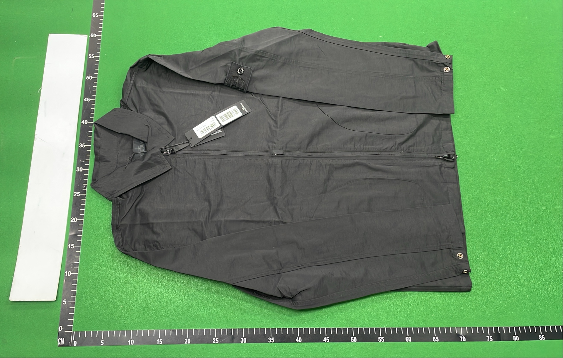 Black Zip-Up Jacket with Two Front Pockets