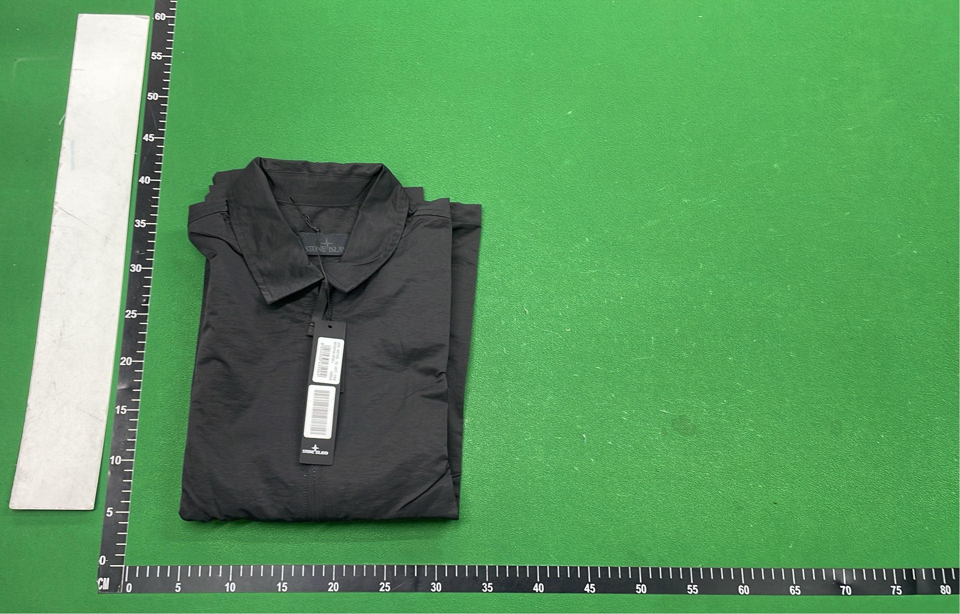Black Zip-Up Jacket with Two Front Pockets