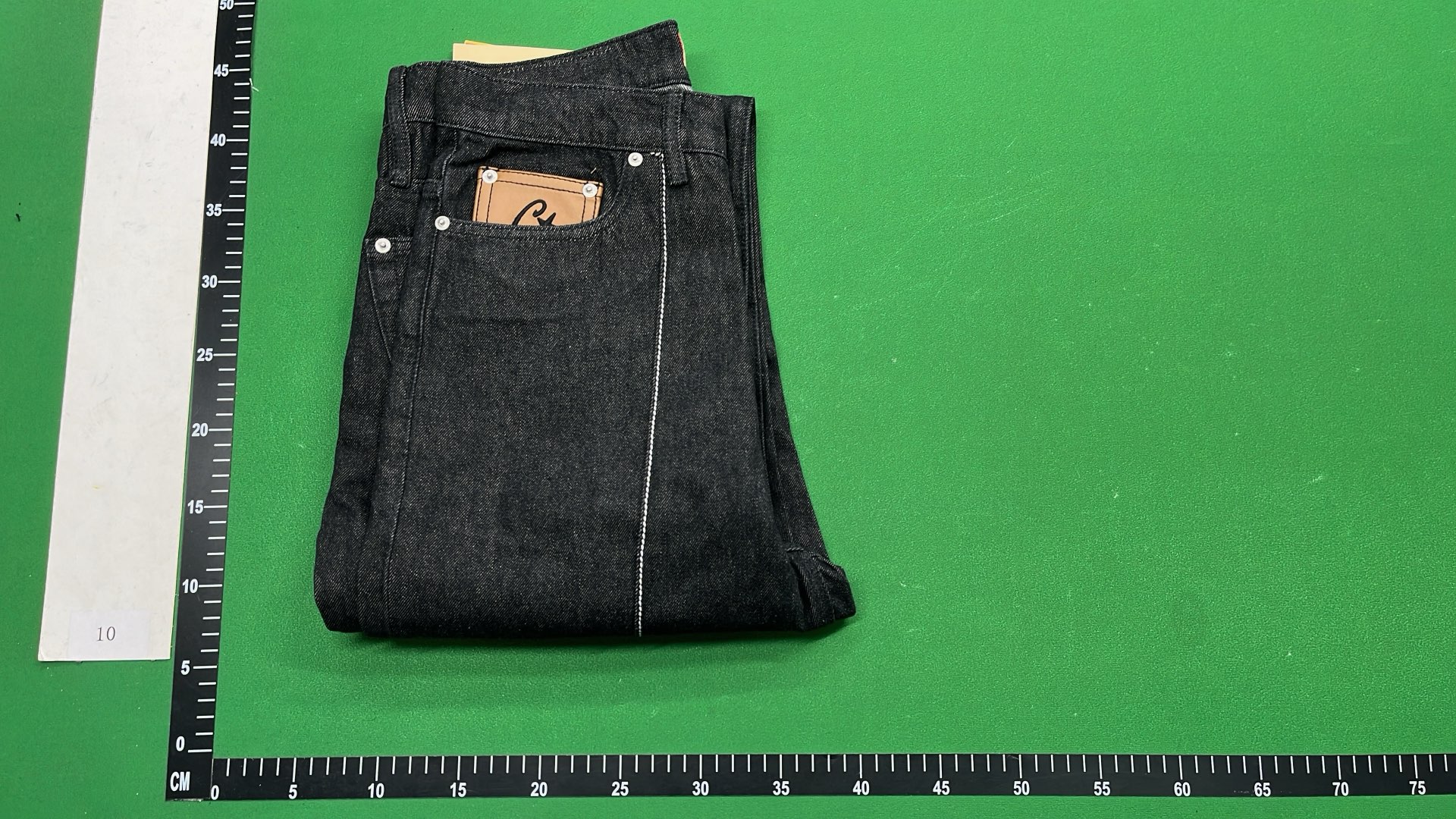 Black Distressed Denim Jeans with Star Patch Design