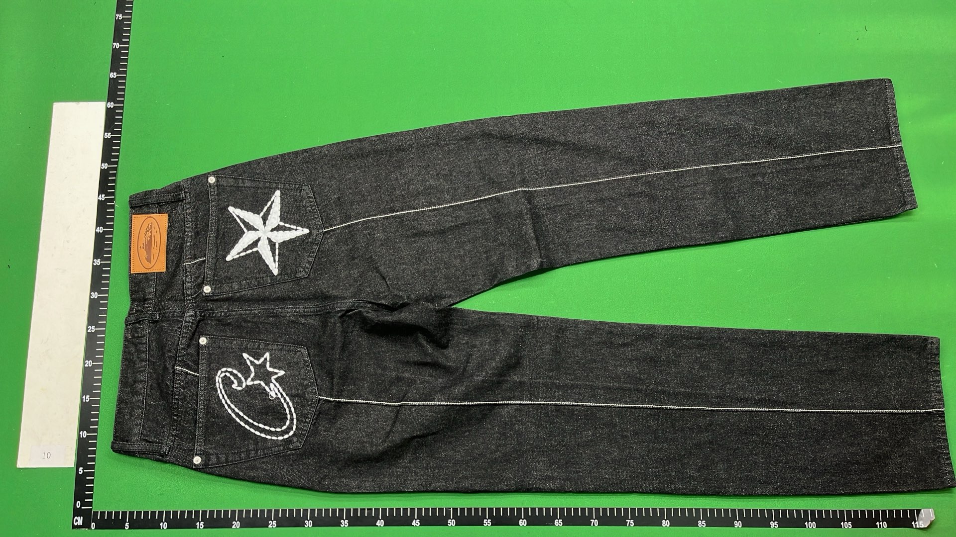 Black Distressed Denim Jeans with Star Patch Design
