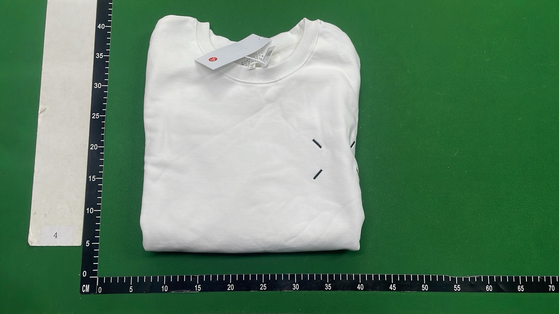 Black Minimalist Sweatshirt with Subtle Cross Logo