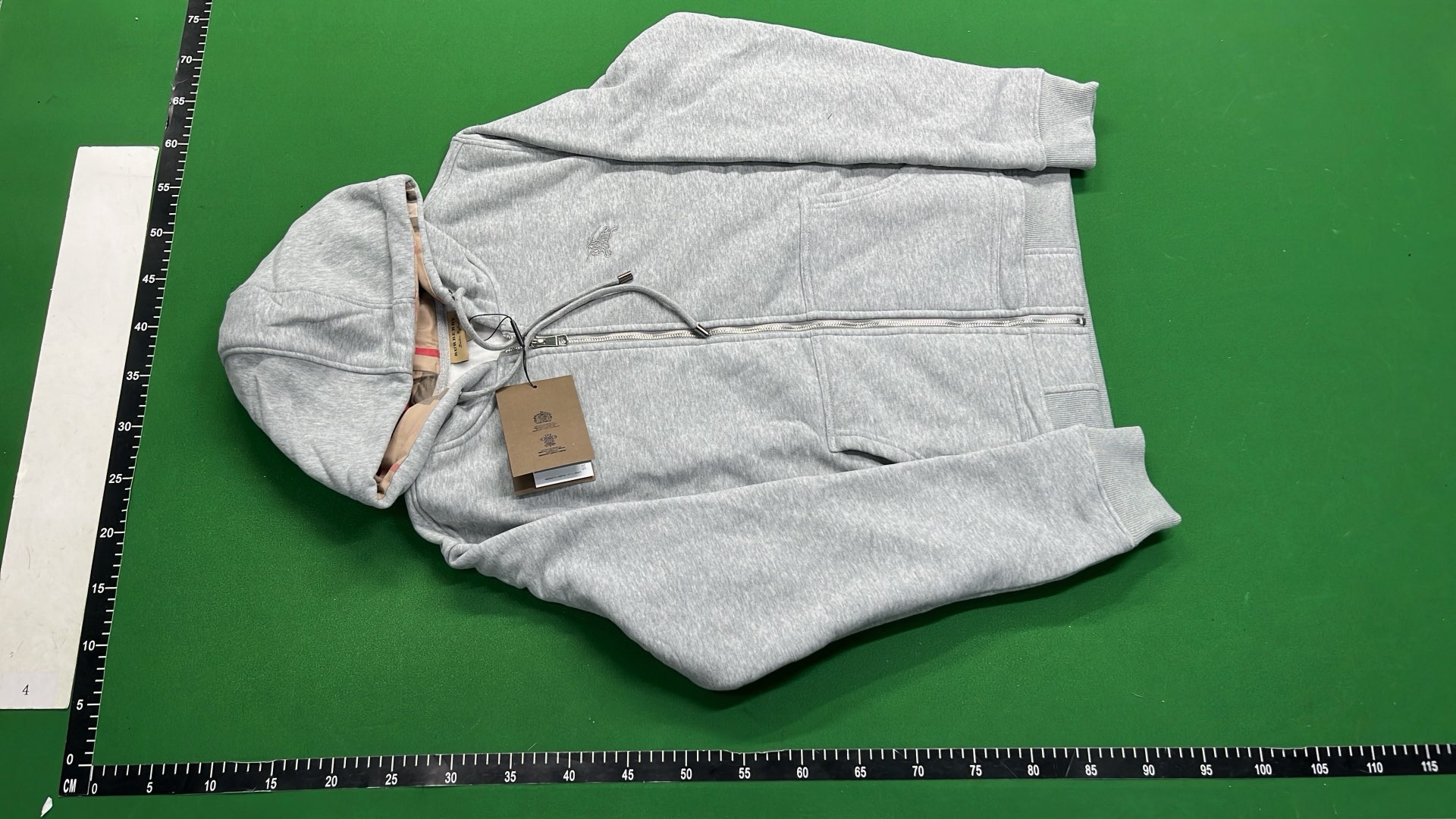 Gray Zip-Up Hoodie with Check Lining and Front Pockets