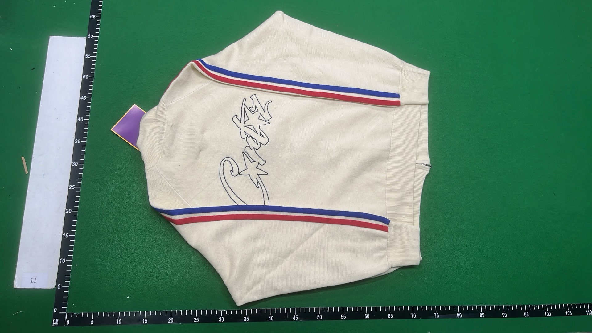 Cream Track Jacket with Red and Blue Stripes
