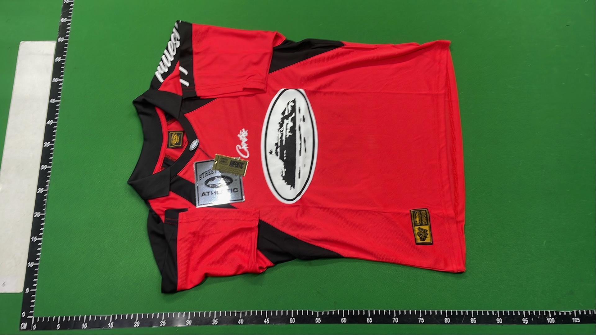 Red and Black Cortez Jersey with 'rulestheworld' Sleeve Design