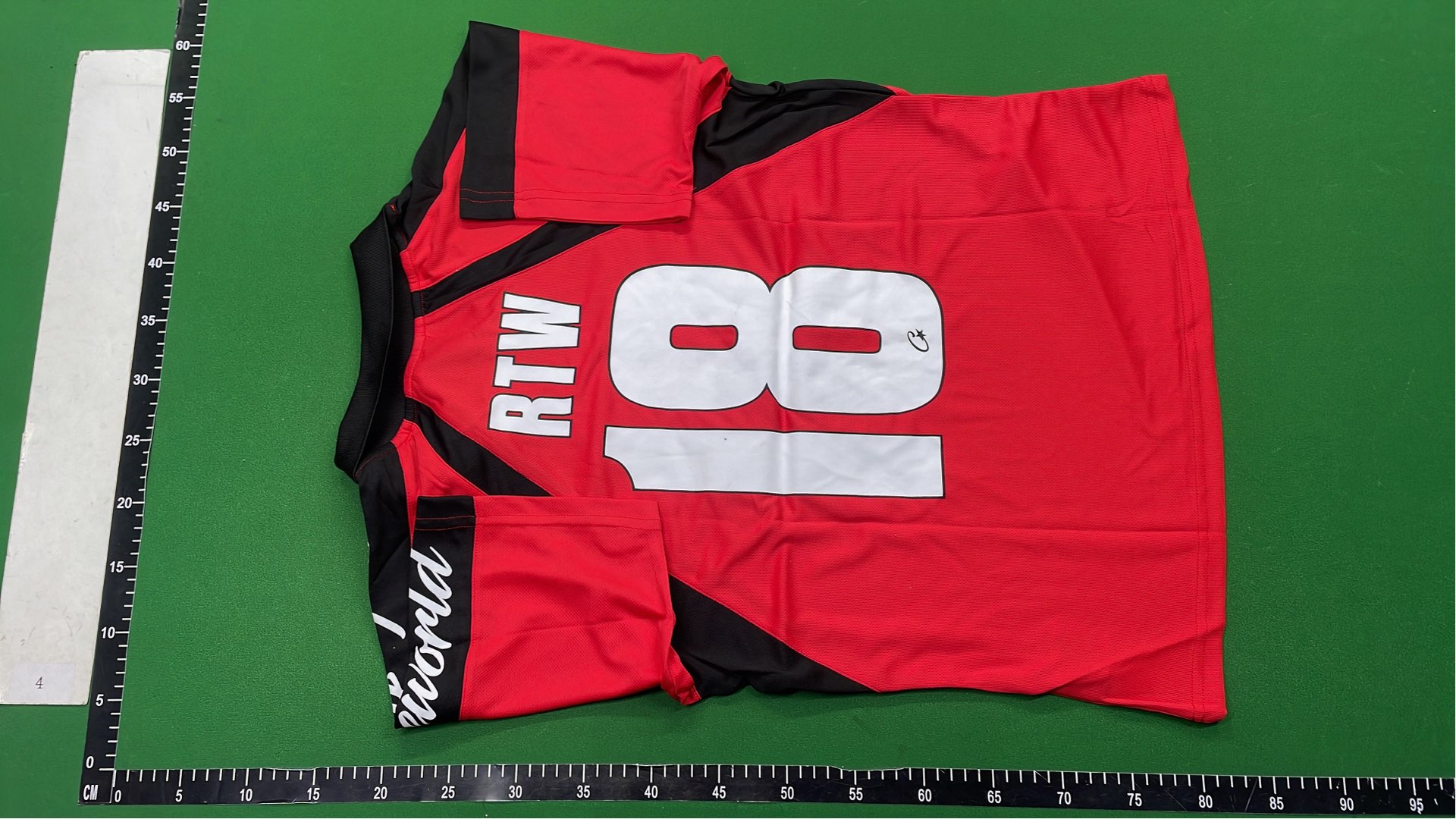 Red and Black Cortez Jersey with 'rulestheworld' Sleeve Design