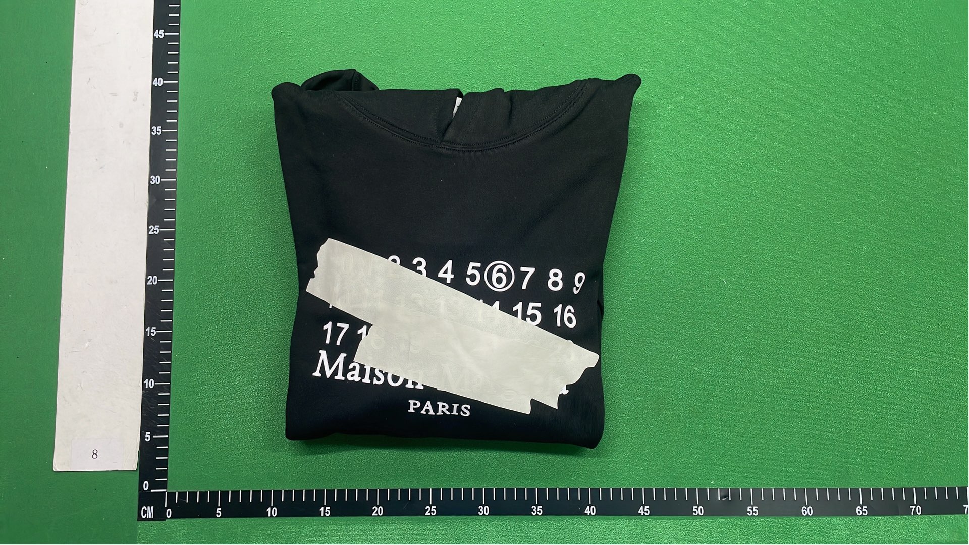 Black Hoodie with Number Pattern Design