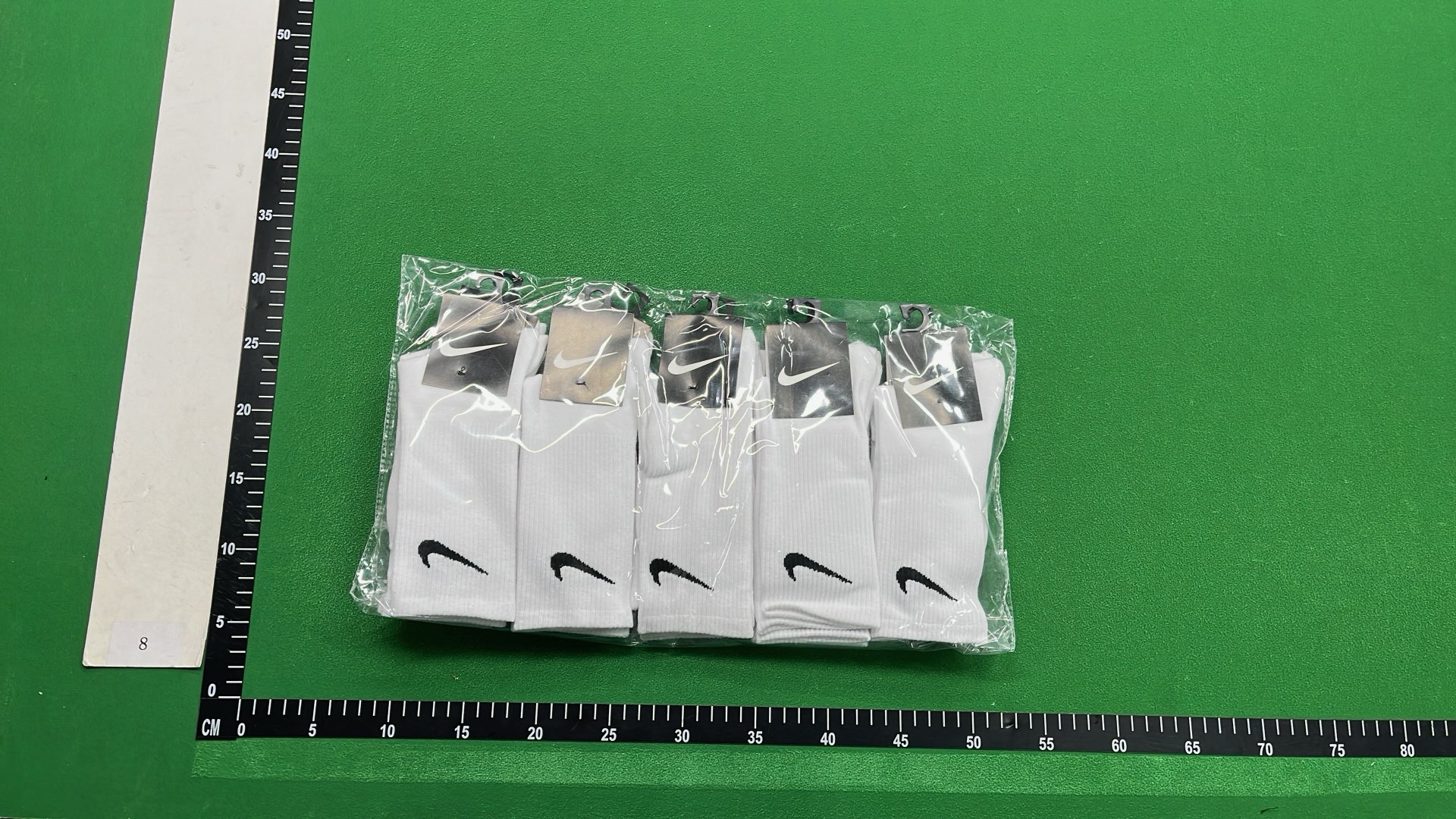 Nike Black Socks with White Swoosh Logo