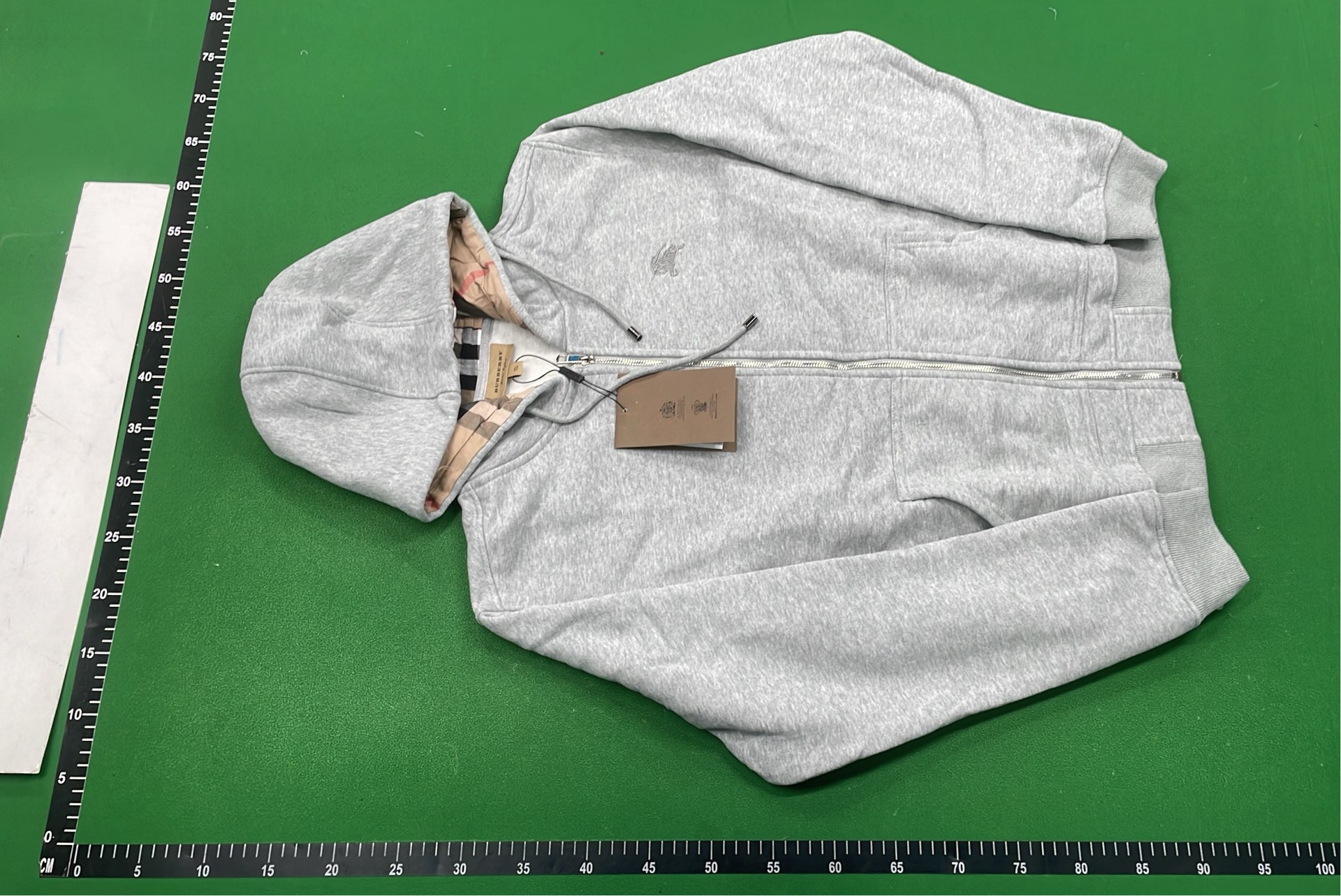 Gray Zip-Up Hoodie with Check Lining and Front Pockets