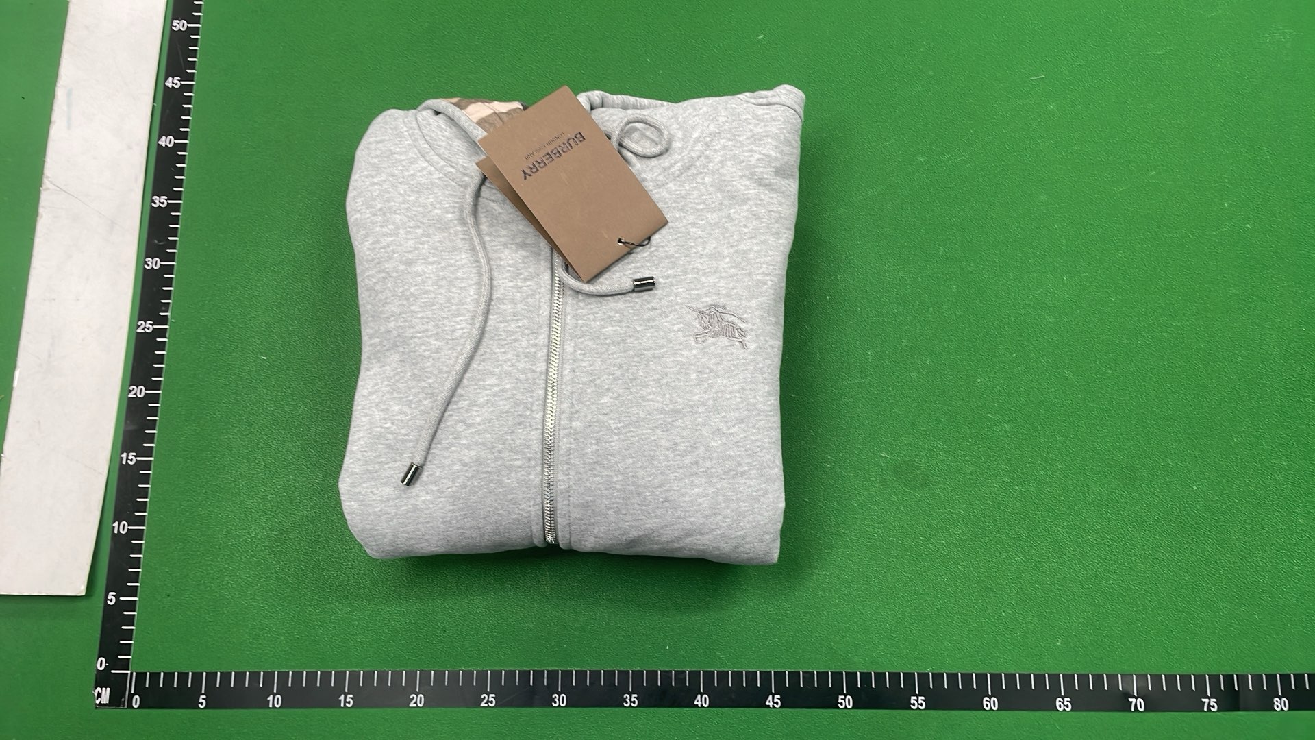 Gray Zip-Up Hoodie with Check Lining and Front Pockets