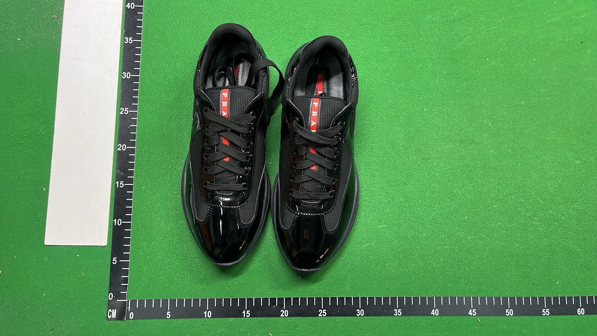 Black Patent Leather Sneakers with Red Accent