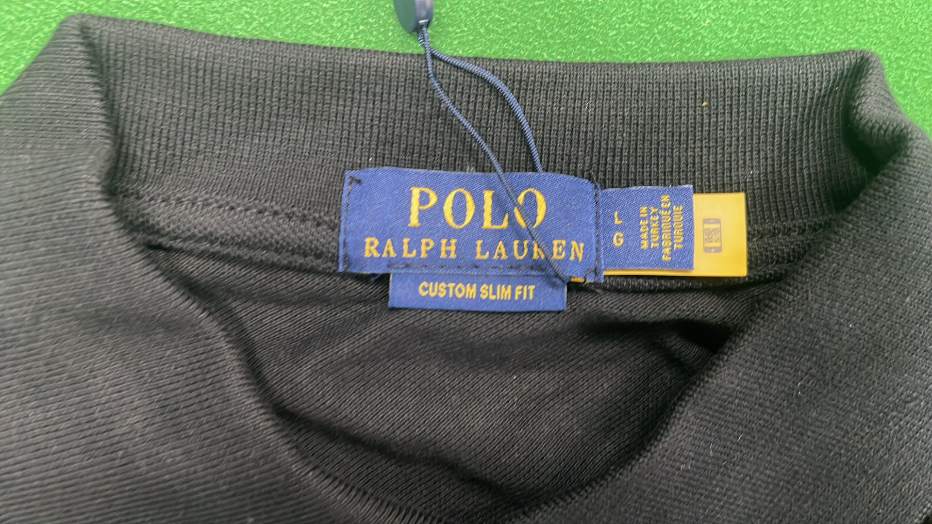 Black Polo Shirt with Red Logo