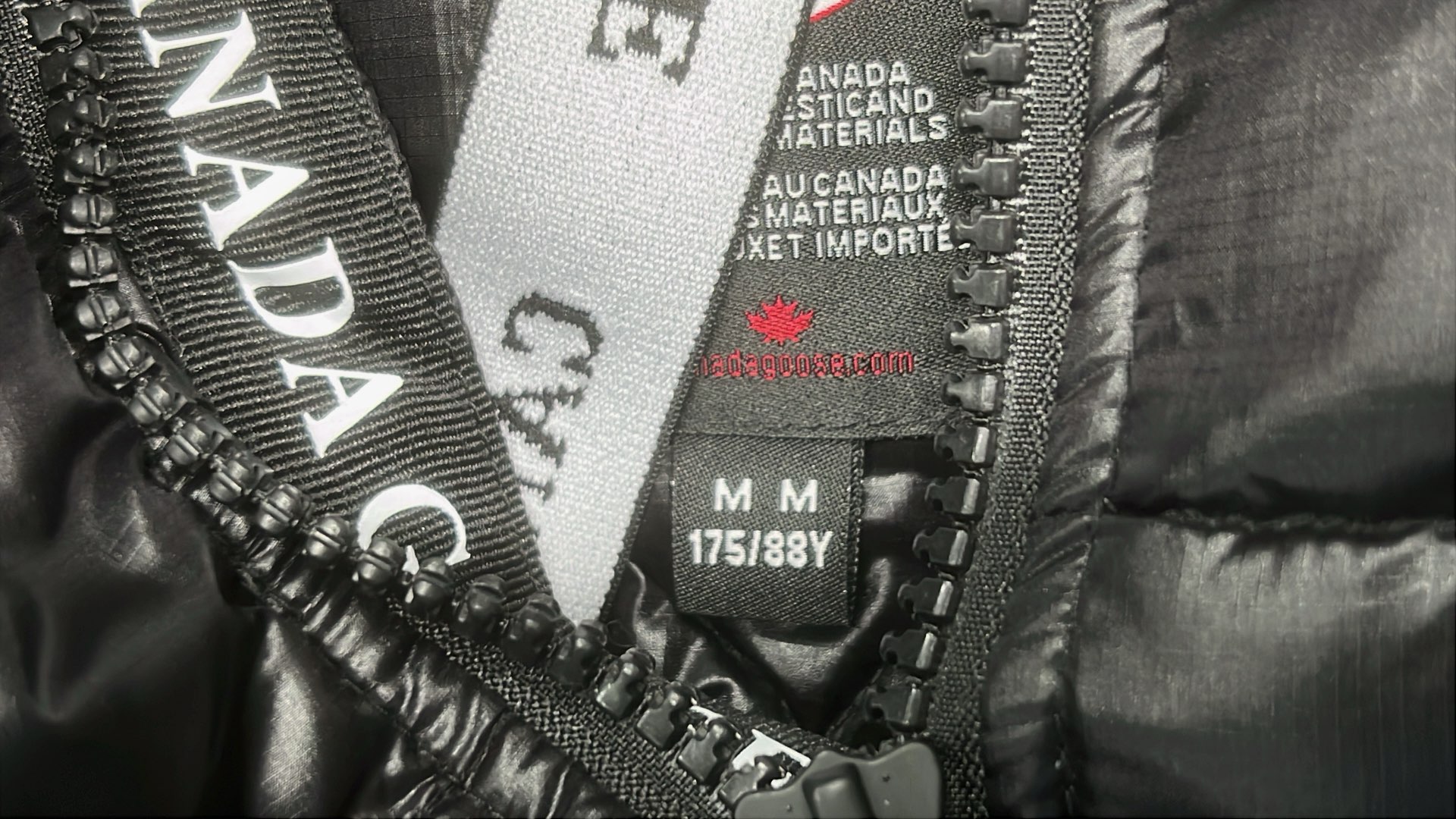 Canada Goose Black Down Jacket with Hood and Logo Patch