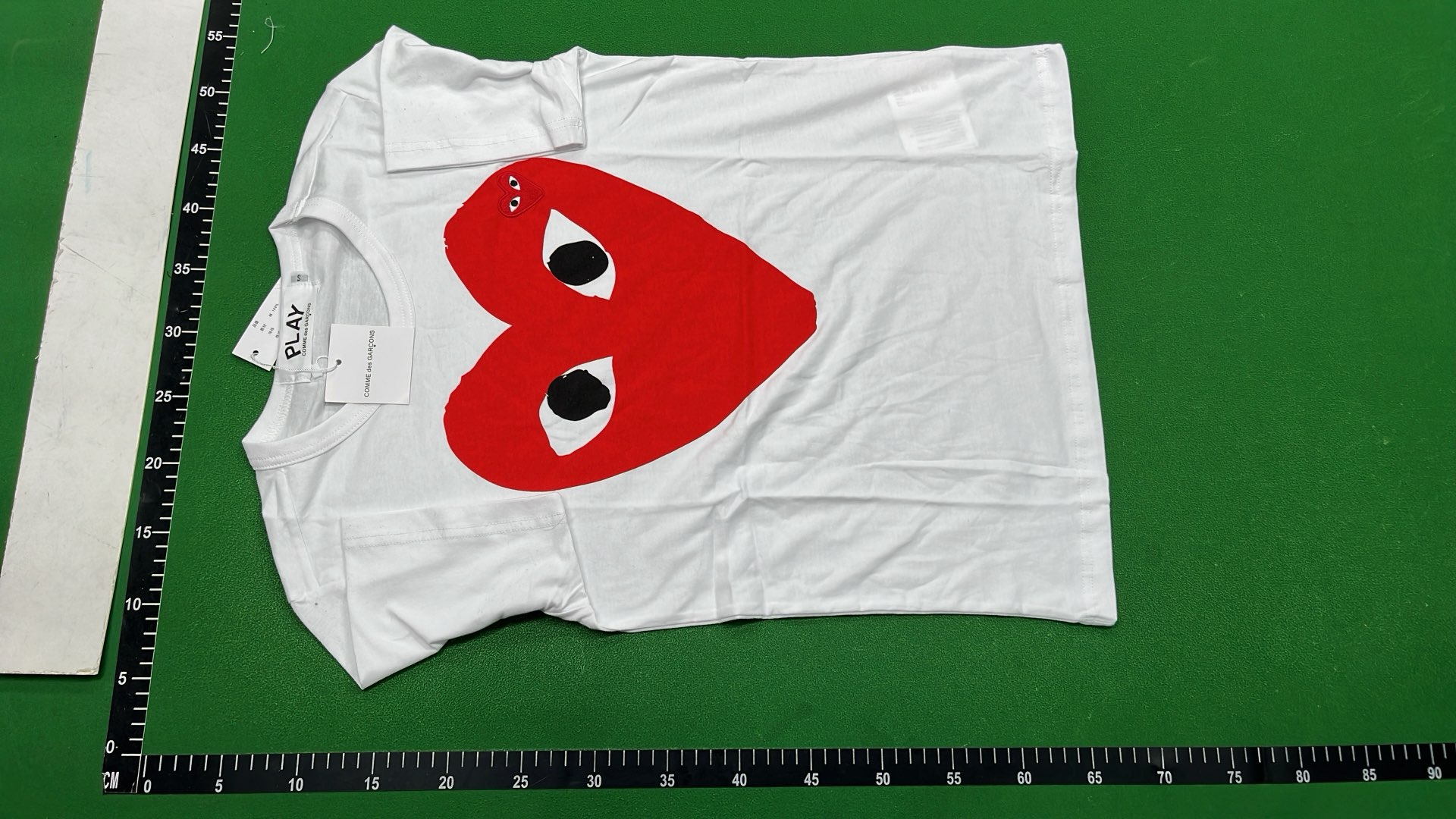 White T-Shirt with Red Heart Eyes Design