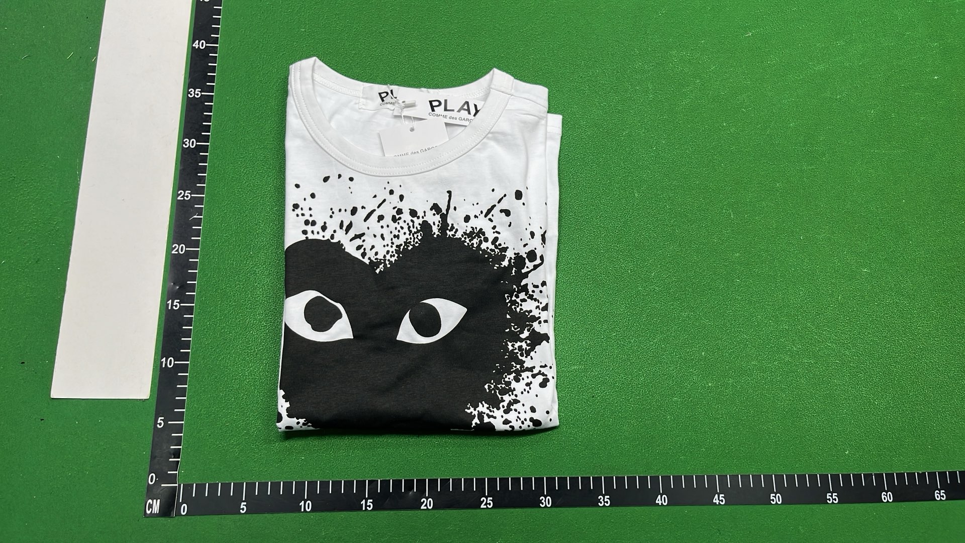 White T-Shirt with Red Heart Eyes Design