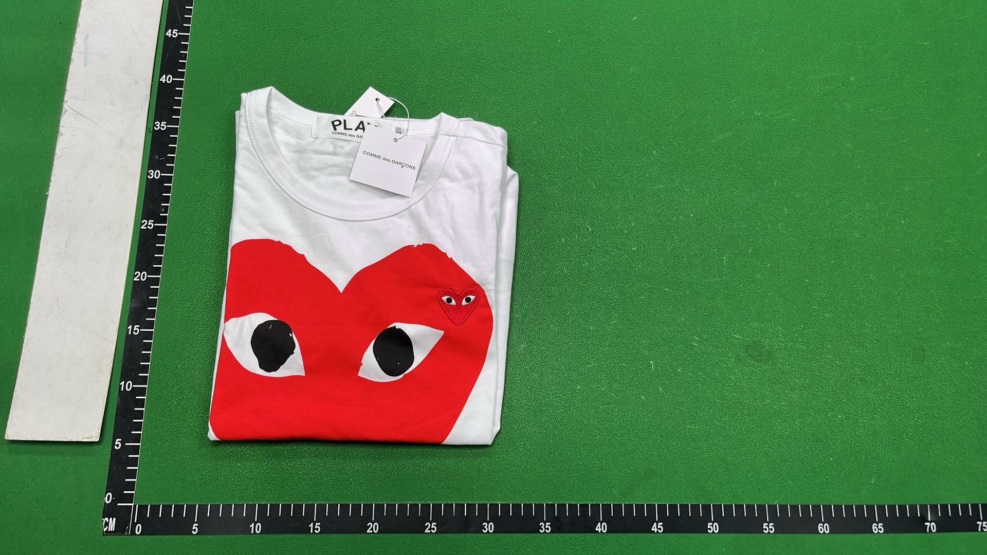 White T-Shirt with Red Heart Eyes Design