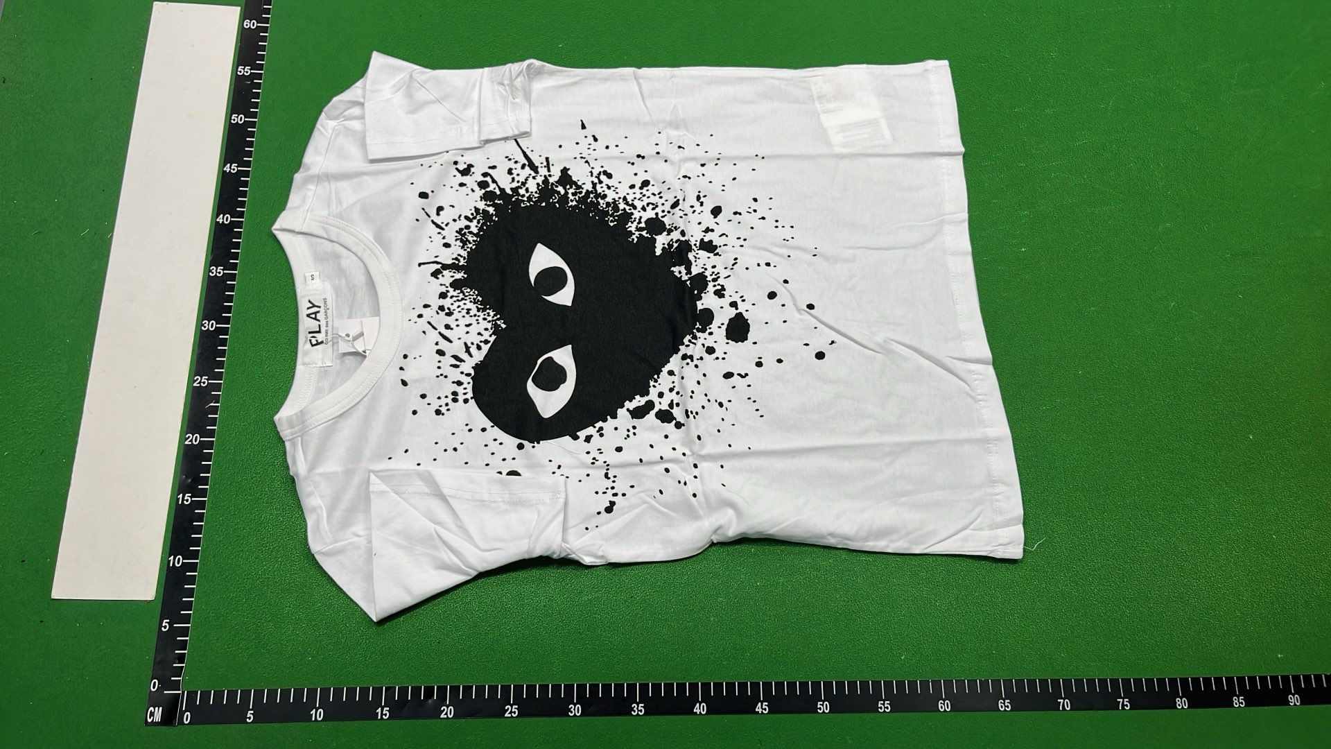 White T-Shirt with Red Heart Eyes Design