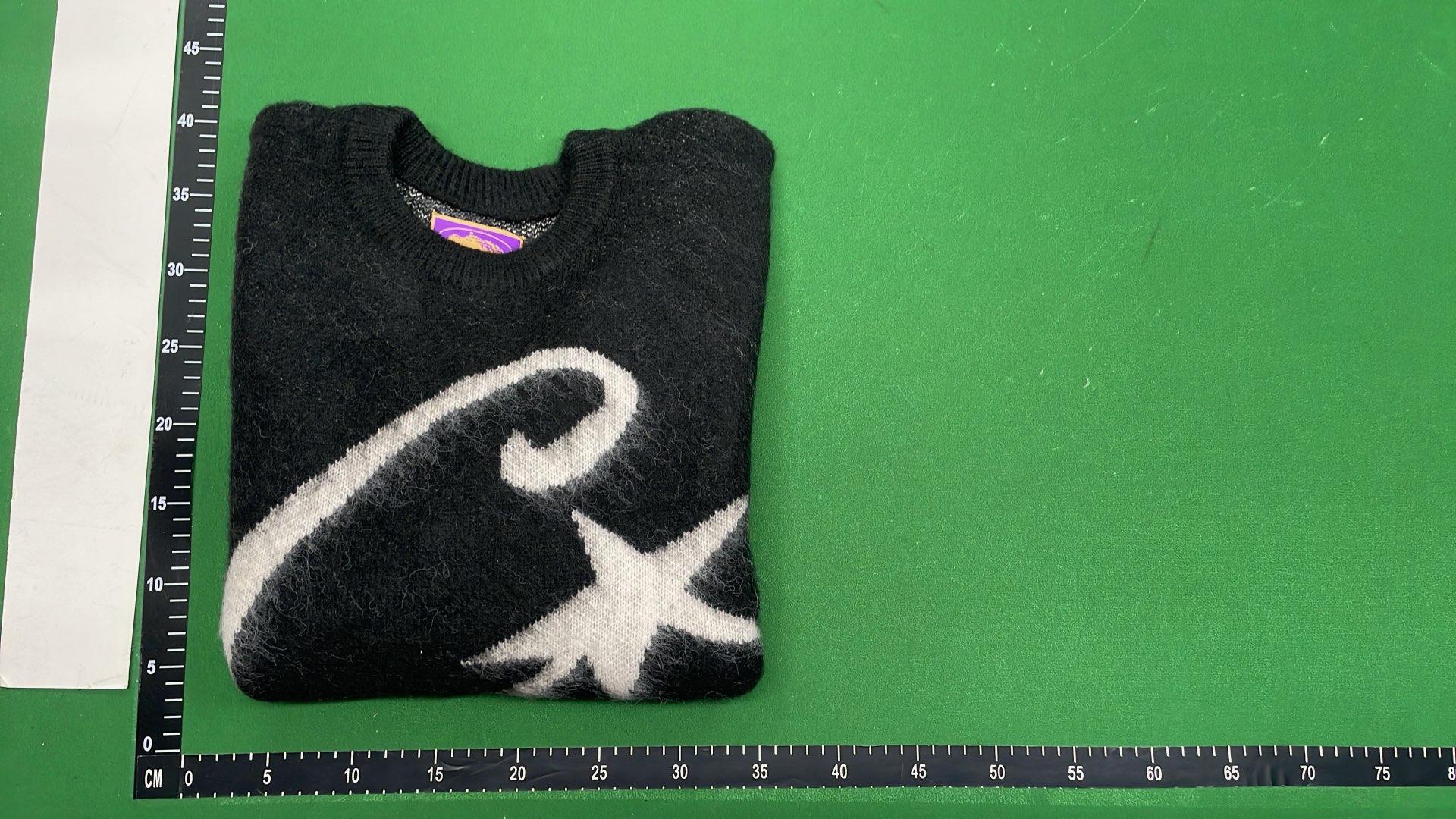 Black CJ Logo Sweater with White Star Design