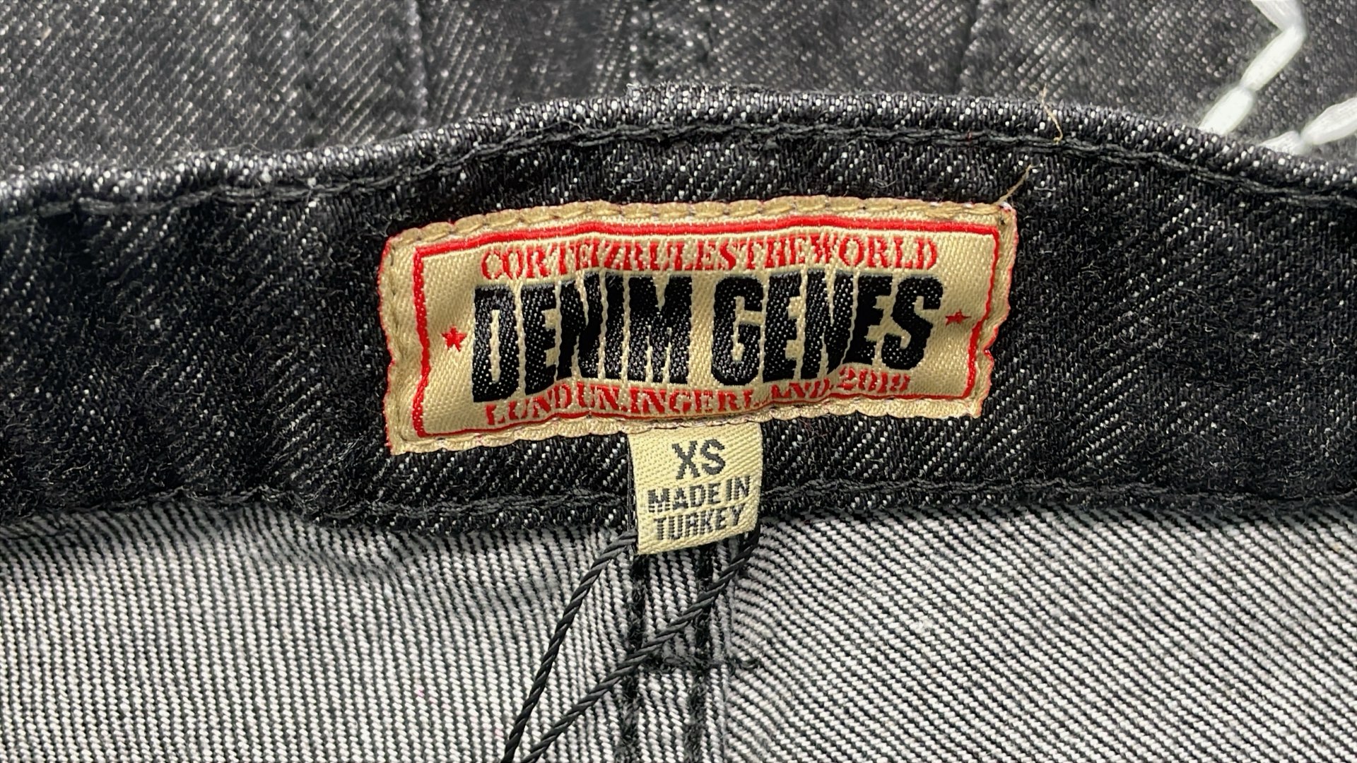 Black Distressed Denim Jeans with Star Patch Design