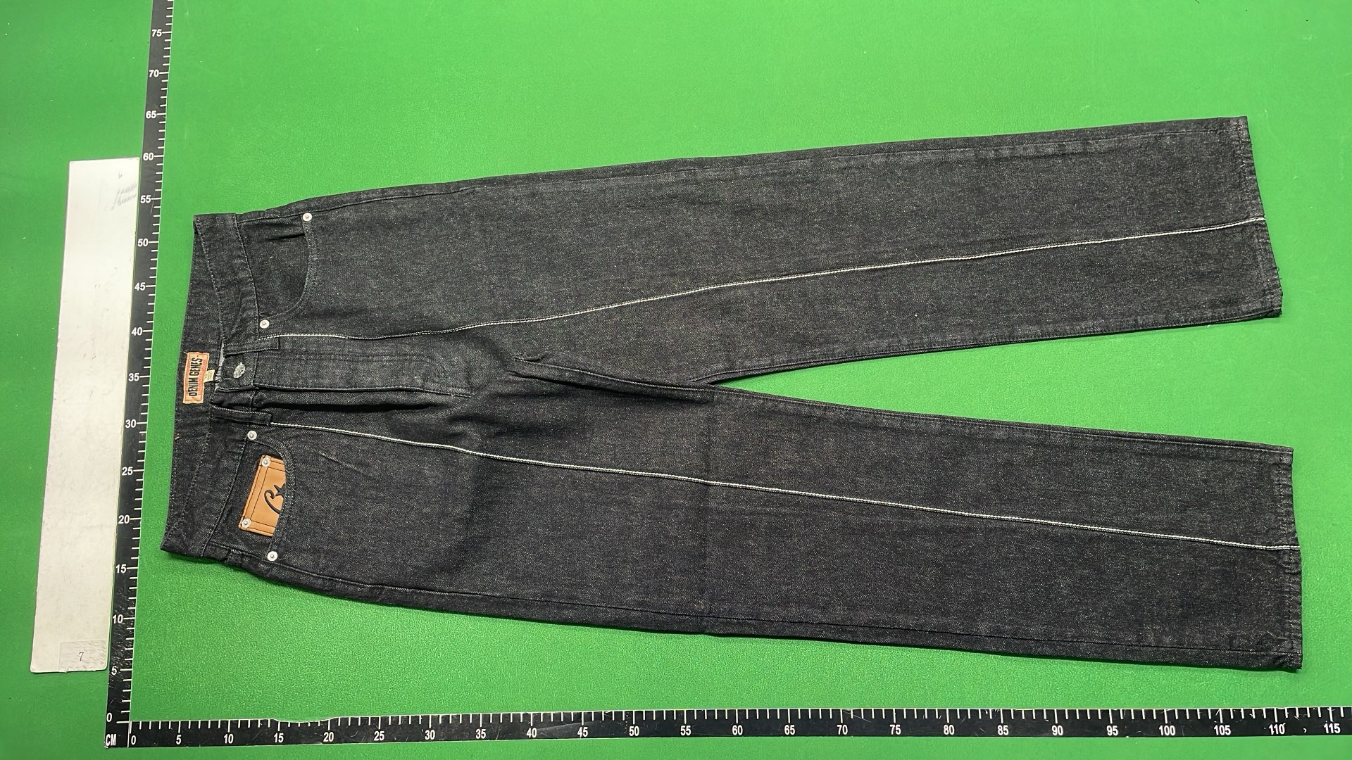 Black Distressed Denim Jeans with Star Patch Design