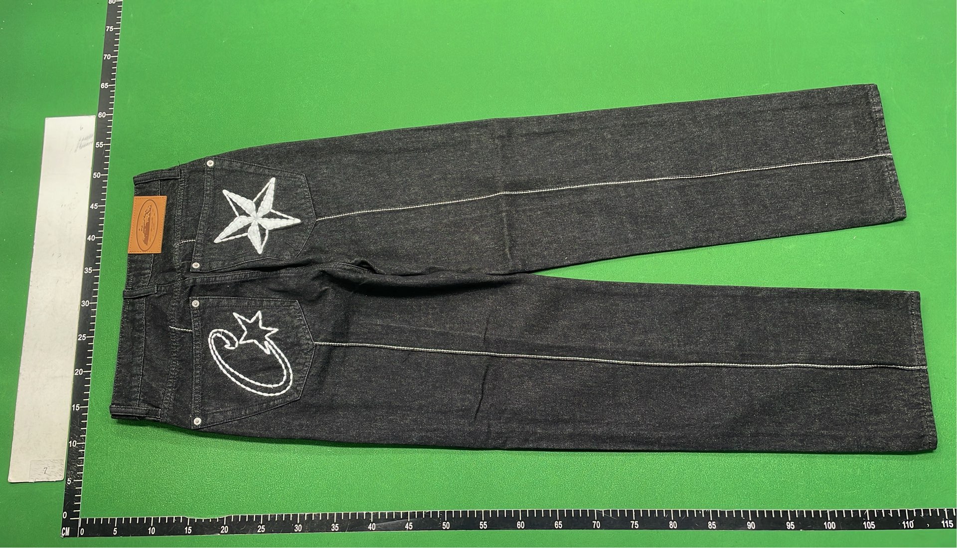 Black Distressed Denim Jeans with Star Patch Design