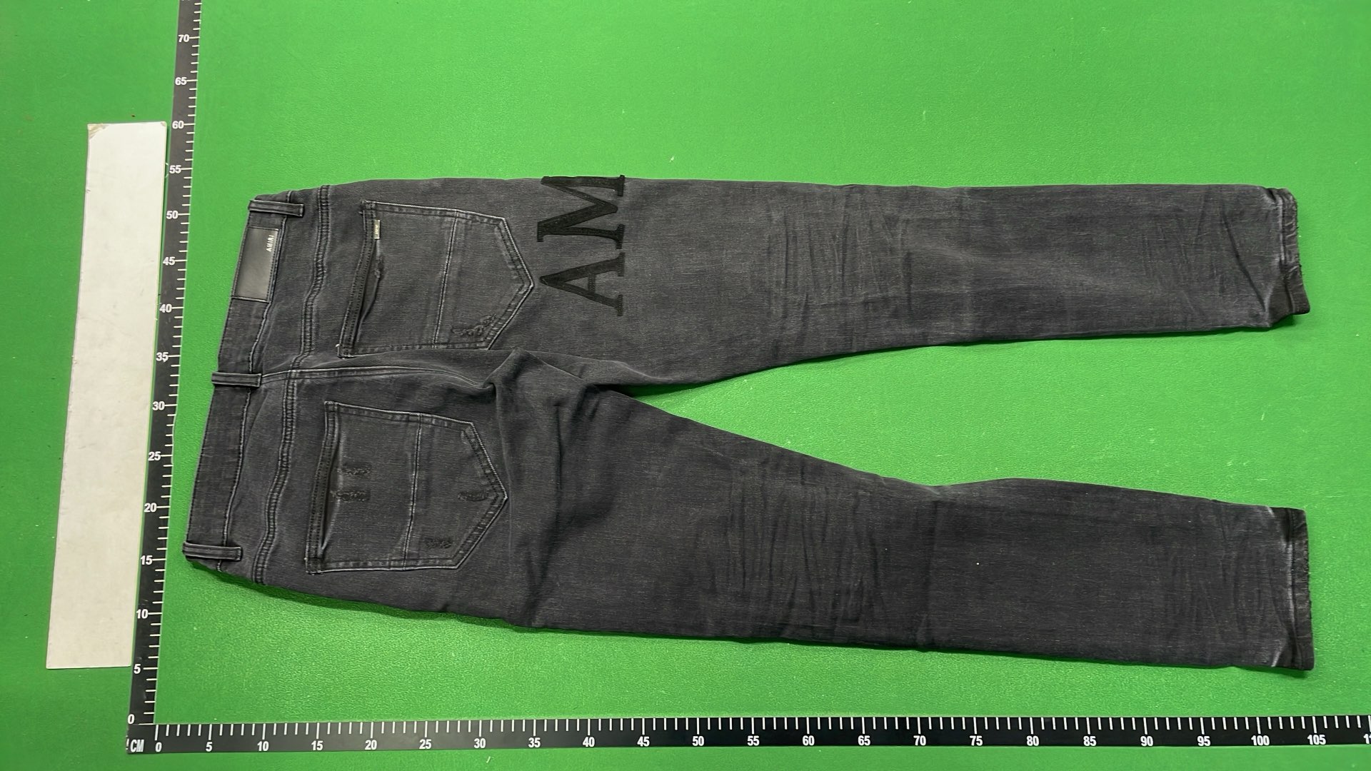 Distressed Black Denim Jeans with Bold Logo Design