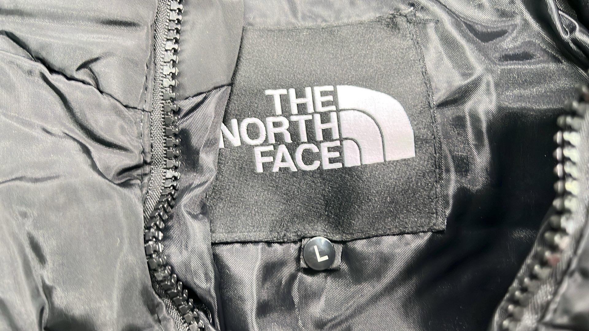The North Face White Puffer Jacket with Black Hood