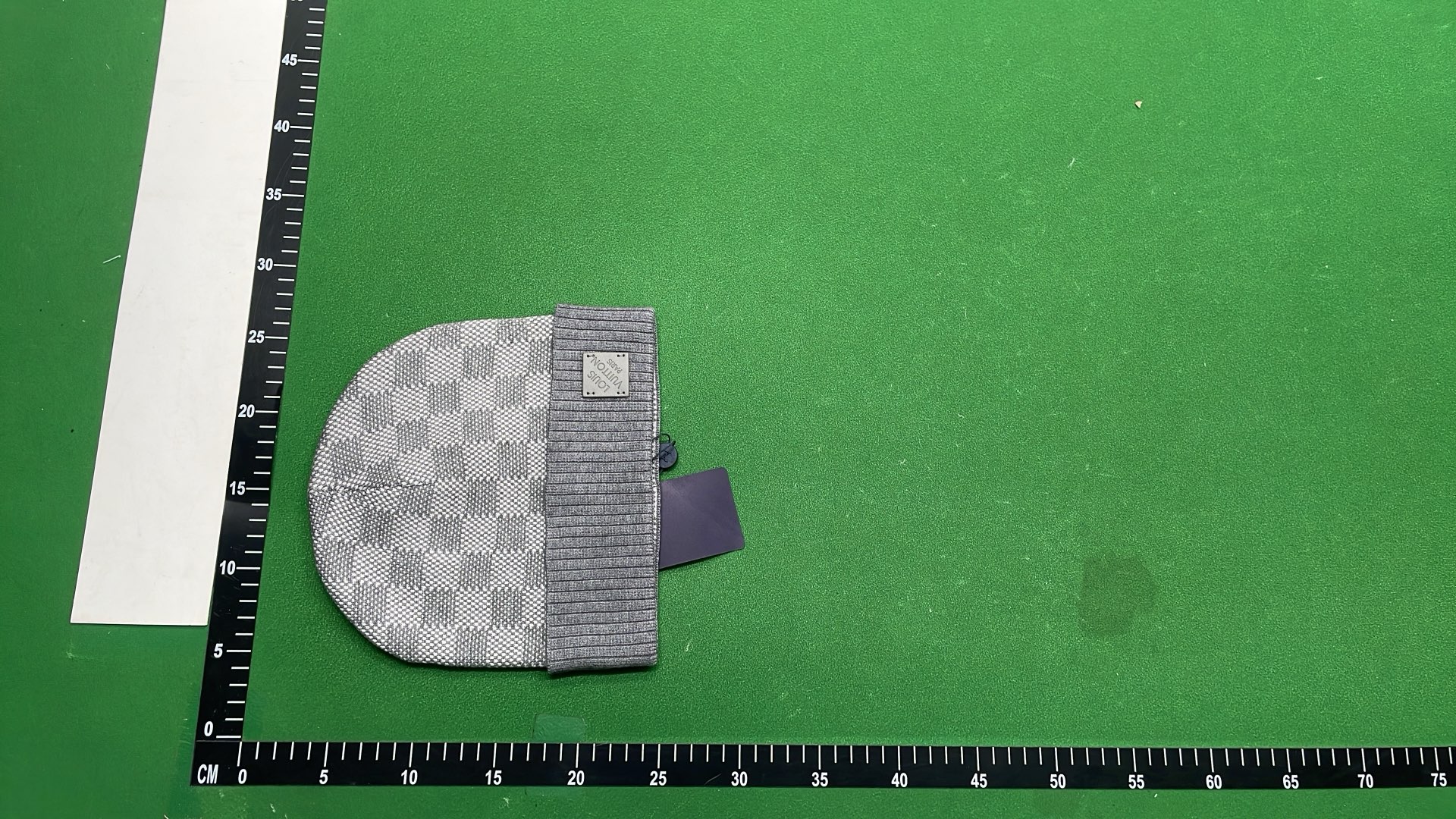 Black Knit Beanie with Patterned Design and Metal Tag
