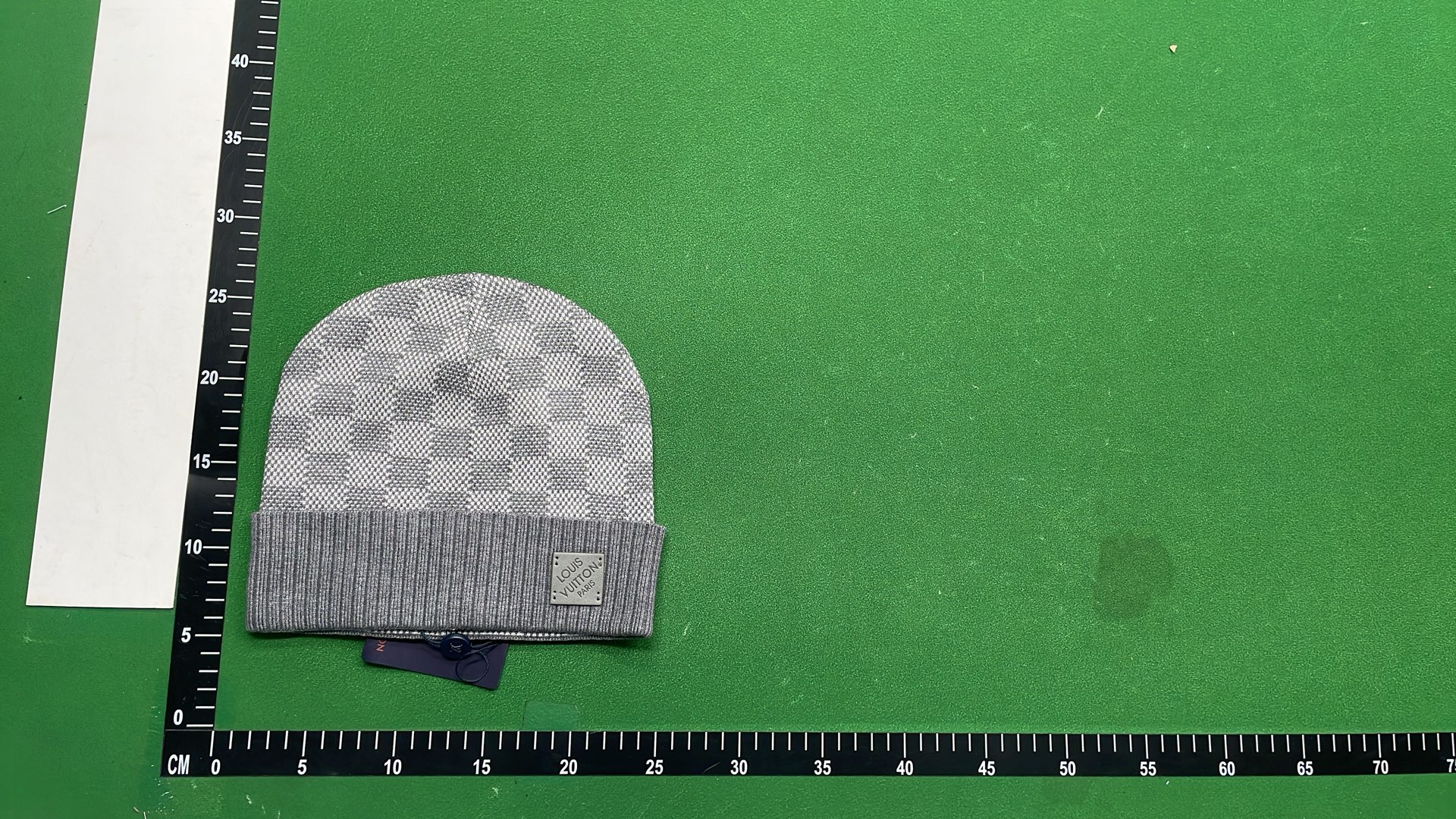 Black Knit Beanie with Patterned Design and Metal Tag